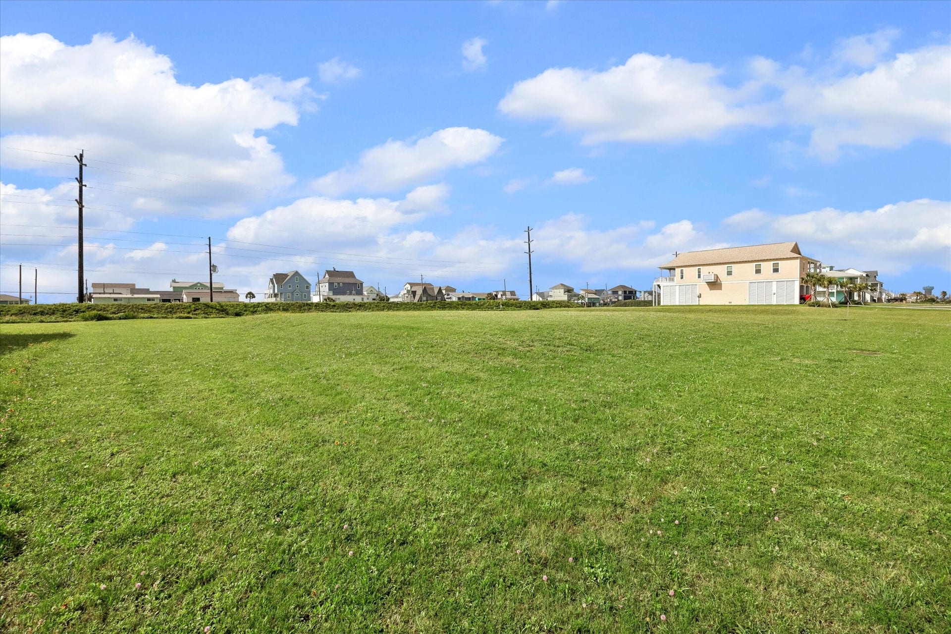21205 Scissor Tail Lane, Galveston, TX 77554 Open sky and salt air greet you across the lot, with power already running along the street.