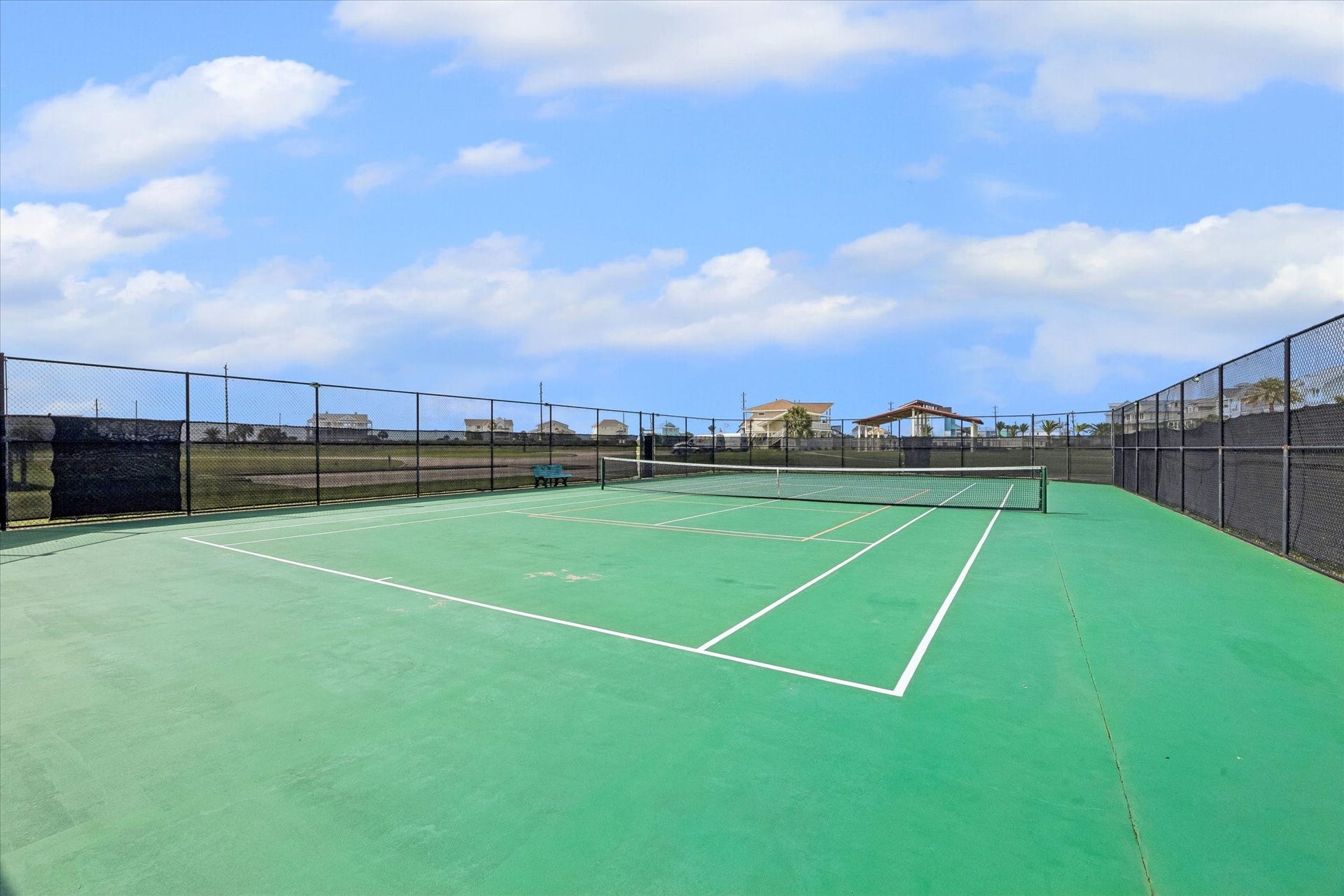 21205 Scissor Tail Lane, Galveston, TX 77554 The community tennis court adds another outdoor amenity within Sunset Cove, offering space to play without leaving the neighborhood. A nice bonus for weekend guests, family time, or an active coastal lifestyle.