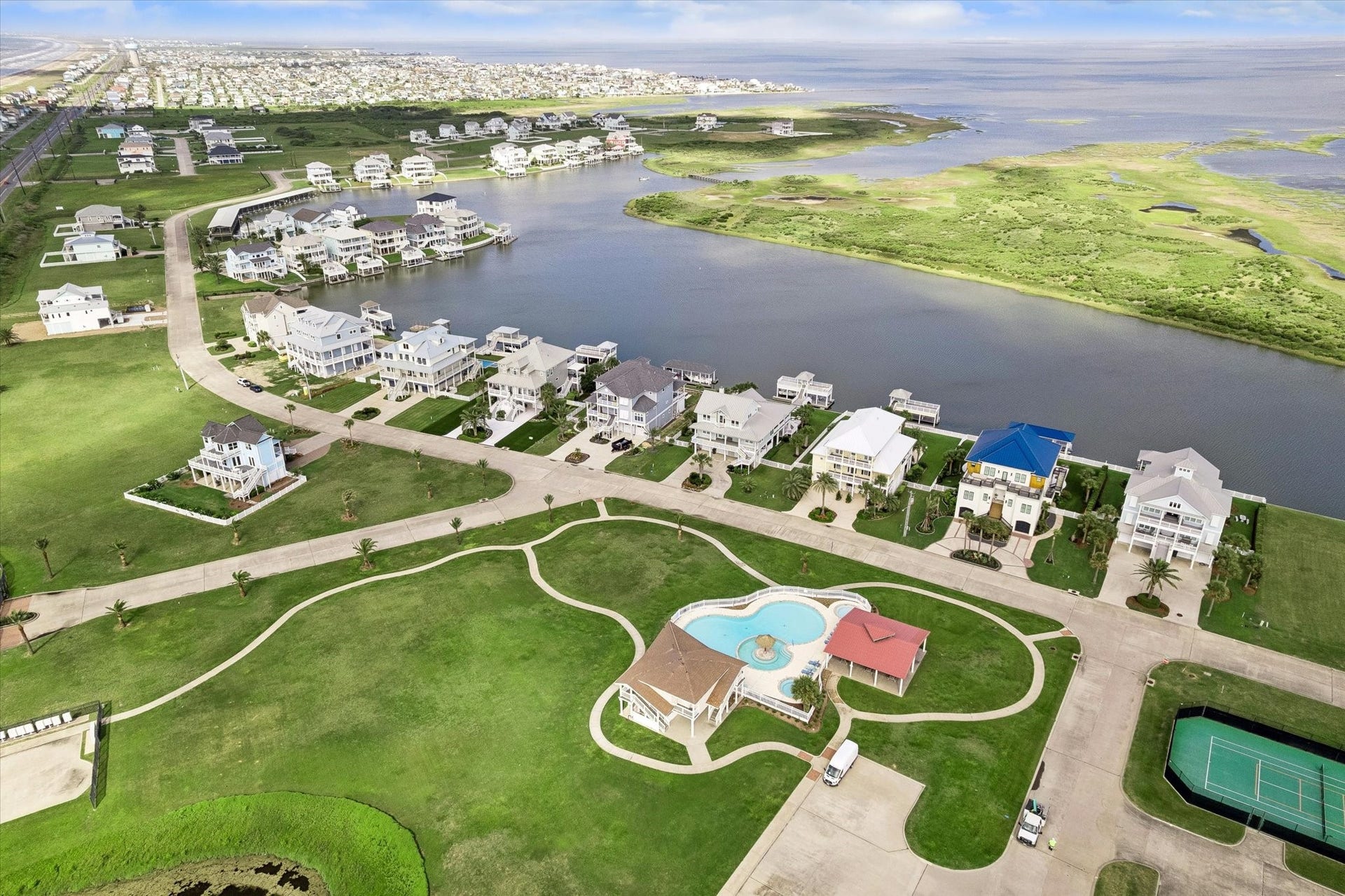 21205 Scissor Tail Lane, Galveston, TX 77554 Neighborhood amenities sit just inside Sunset Cove, with a community pool, tennis court, and wide green spaces set along the water. A quiet coastal setting with room to enjoy the outdoors beyond your own future homesite.