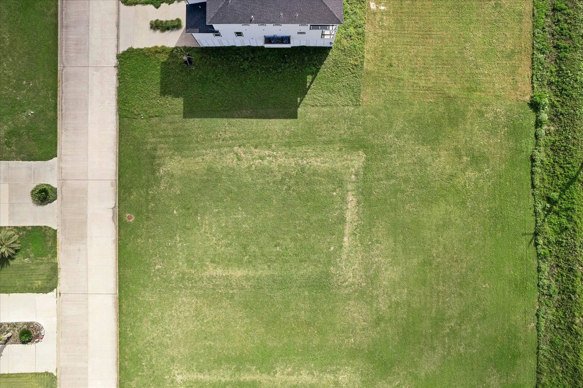 21205 Scissor Tail Lane, Galveston, TX 77554 Cleared and level from above, the lot offers a clean canvas for your custom floor plan with room to spare on every side.