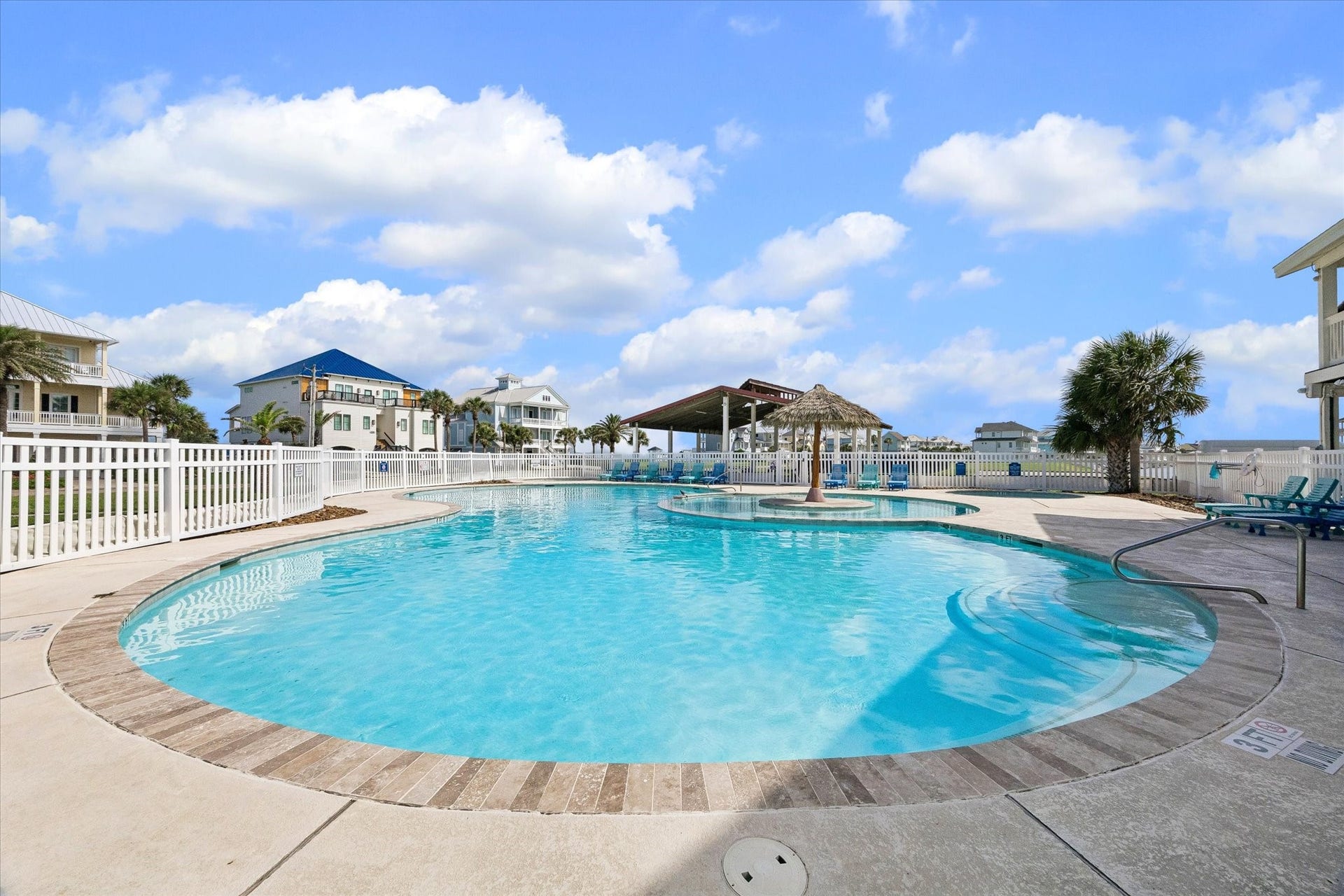 21205 Scissor Tail Lane, Galveston, TX 77554 Community pool access brings a true resort feel to Sunset Cove, with lounge seating, shaded gathering space, and palm-lined surroundings. An easy spot to cool off after a day at the beach or enjoy a relaxed afternoon close to home.