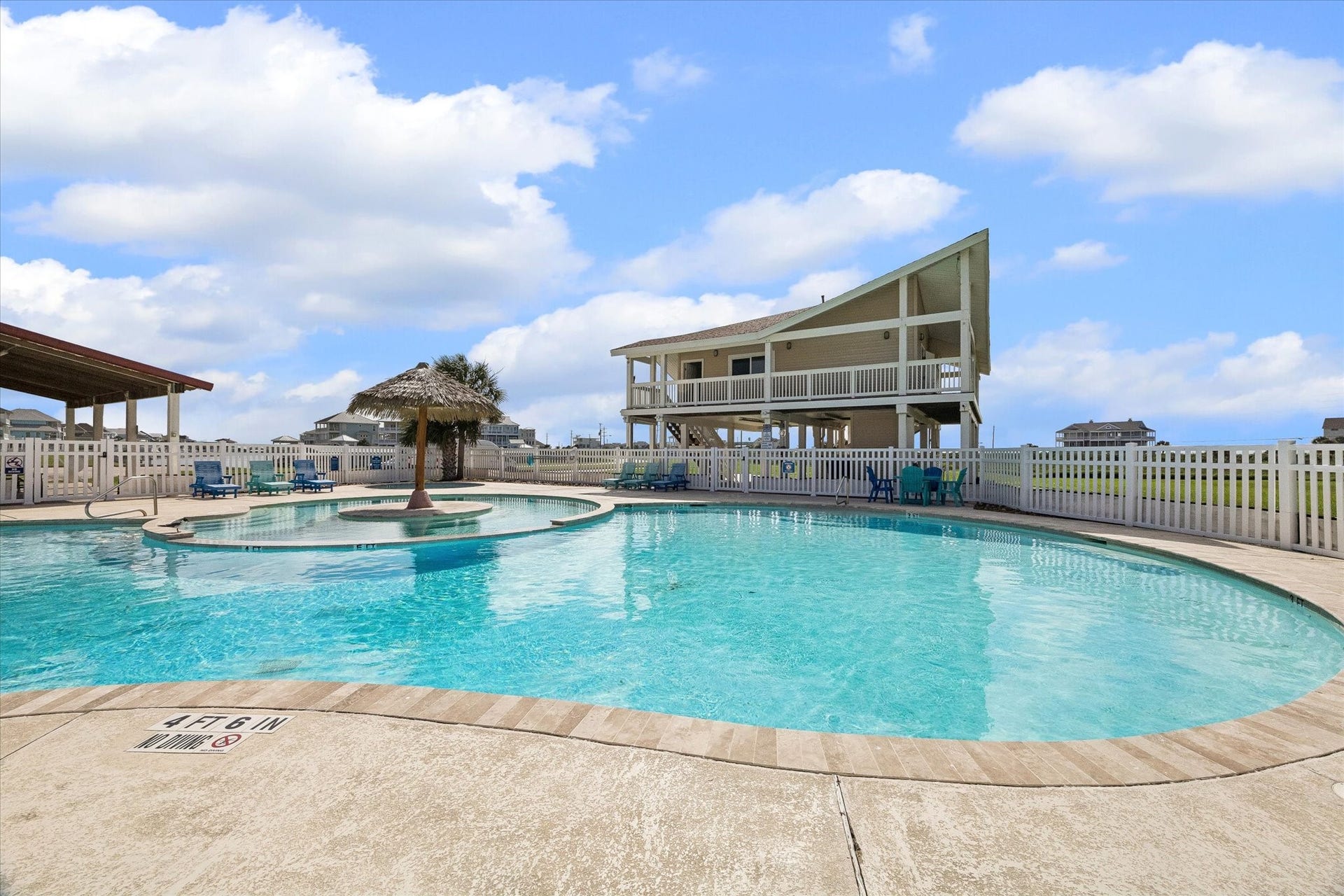 21205 Scissor Tail Lane, Galveston, TX 77554 Another view of the Sunset Cove pool highlights the laid-back coastal setting, with shaded seating and open-air gathering areas nearby. Resort-style amenities add an easy lifestyle element just moments from the homesite.