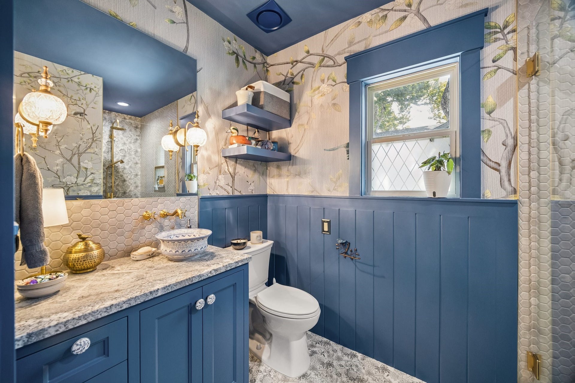 542 Granberry Street, Houston, TX 77007 Unbelievably blue 2nd full bathroom remodel. The tile and wallpaper match, making it feel like you're by the ocean.