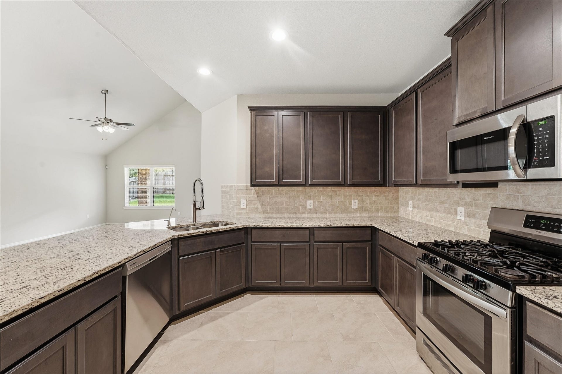 22093 Sun Haven Lane, Porter, TX 77365 Large counter height breakfast bar open to dining area and living room.