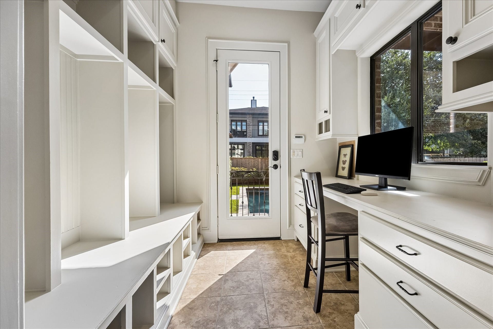4037 Dumbarton Street, Houston, TX 77025 Spacious mudroom and desk area opens from one of two entrances into the home overlooking the backyard.