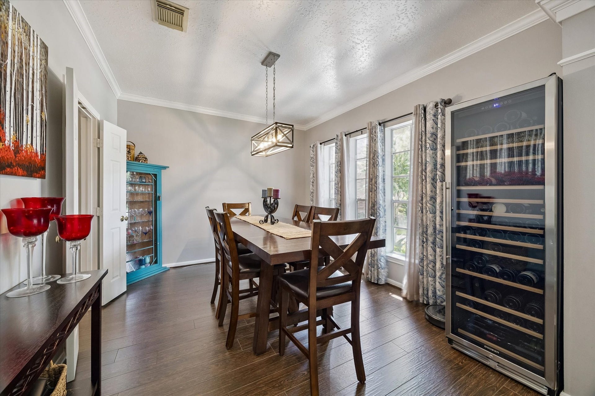 11615 Agate Canyon Lane, Houston, TX 77095 Formal dining area has natural light and crown molding.