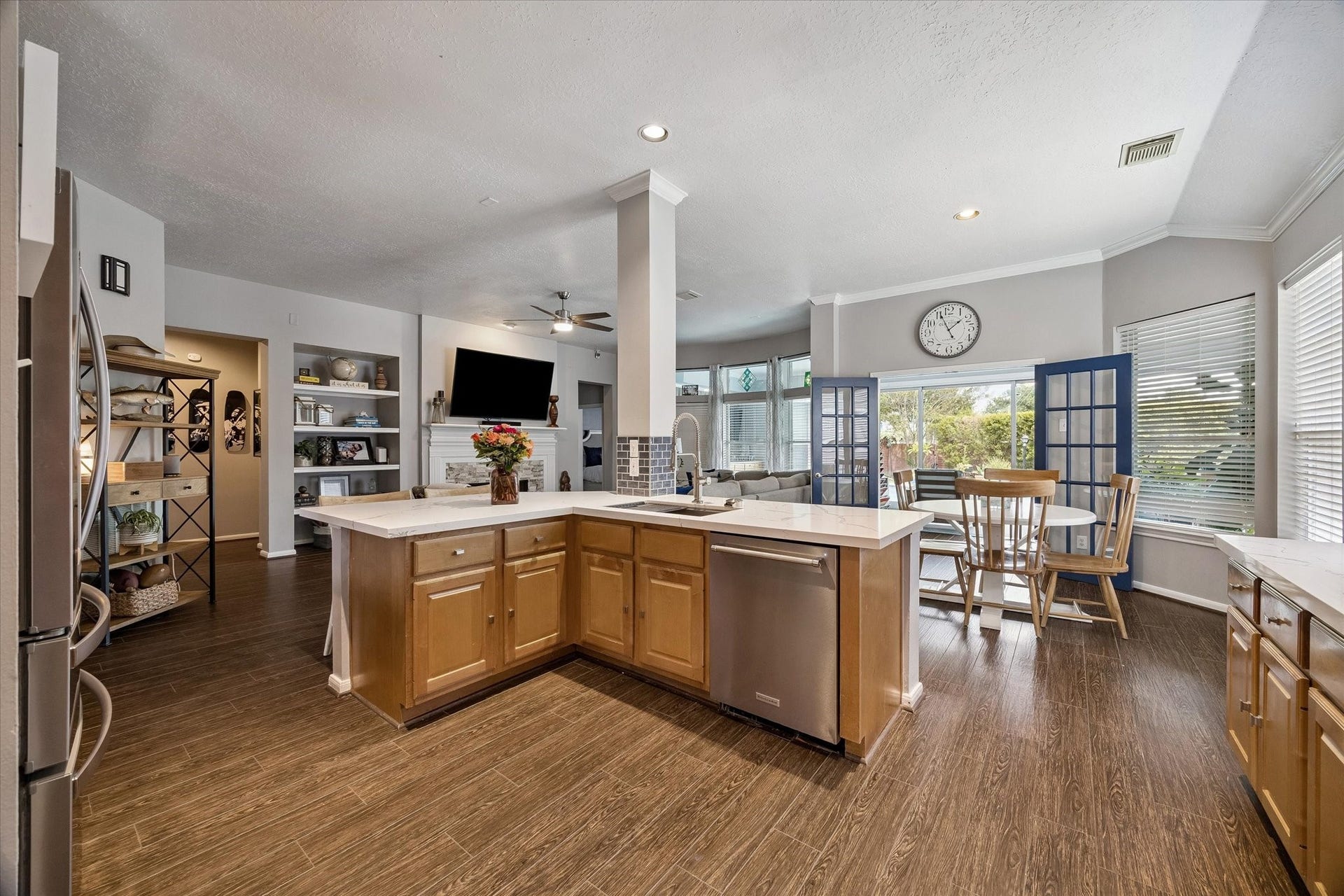11615 Agate Canyon Lane, Houston, TX 77095 The kitchen offers KitchenAid stainless steel appliances and a deep sink making cleaning pots and pans a breeze.