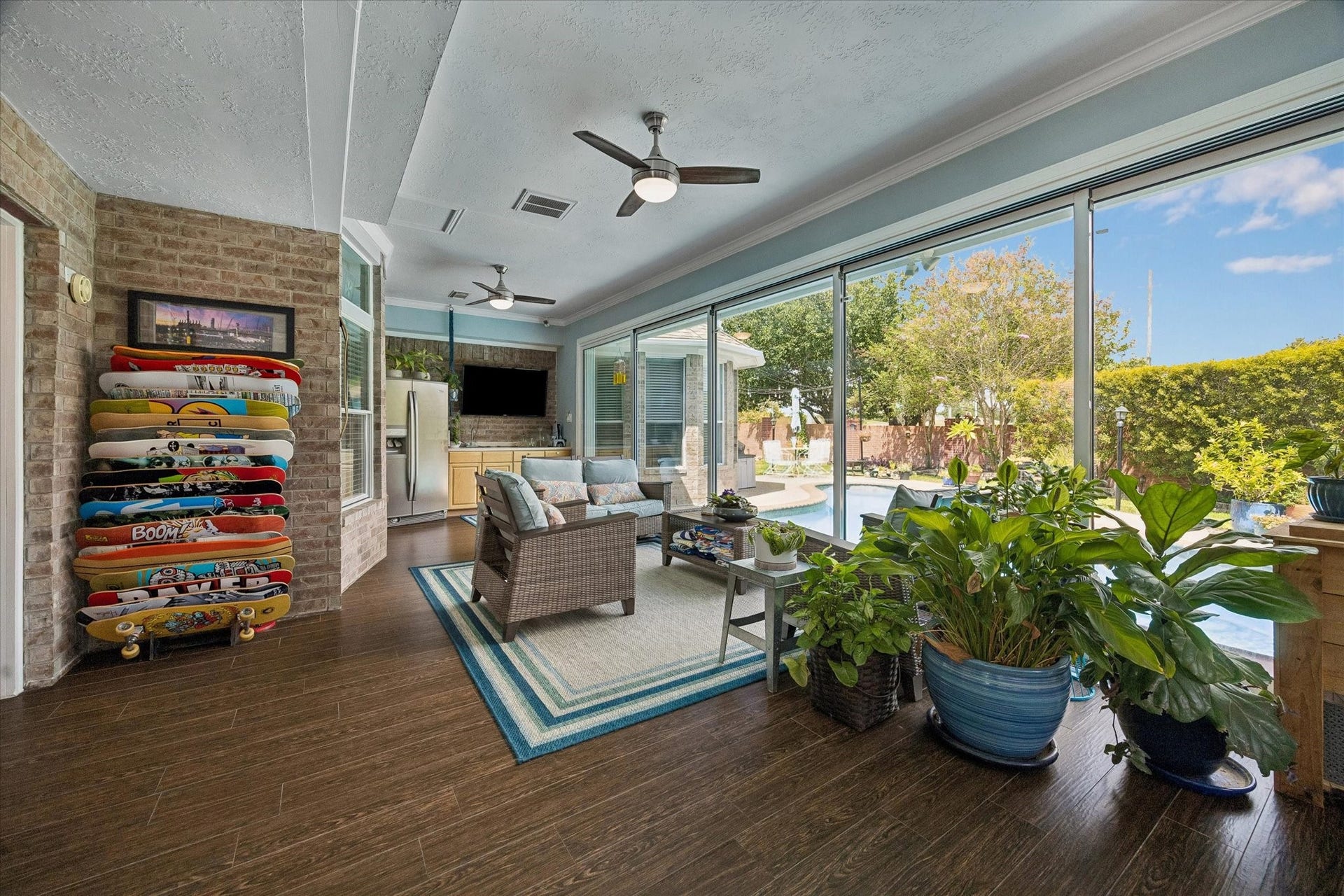 11615 Agate Canyon Lane, Houston, TX 77095 The sunroom features a CUSTOM SLIDING GLASS WALL that transforms the space into an open concept directly to the backyard. This space can also be used as a game room. Perfect for entertaining!