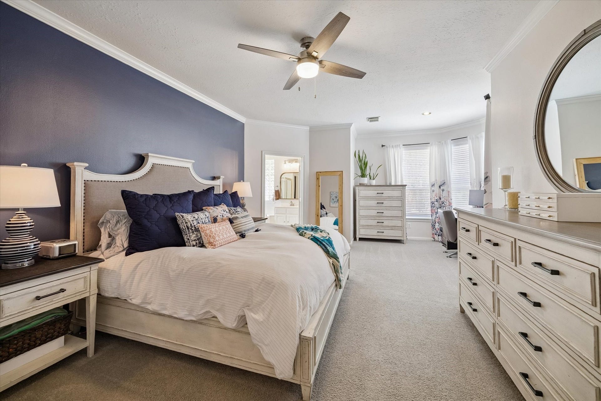 11615 Agate Canyon Lane, Houston, TX 77095 In the primary bedroom you'll find a wrap around, walk-in closet, crown molding and ample space. It also provides a reading nook / alcove area.