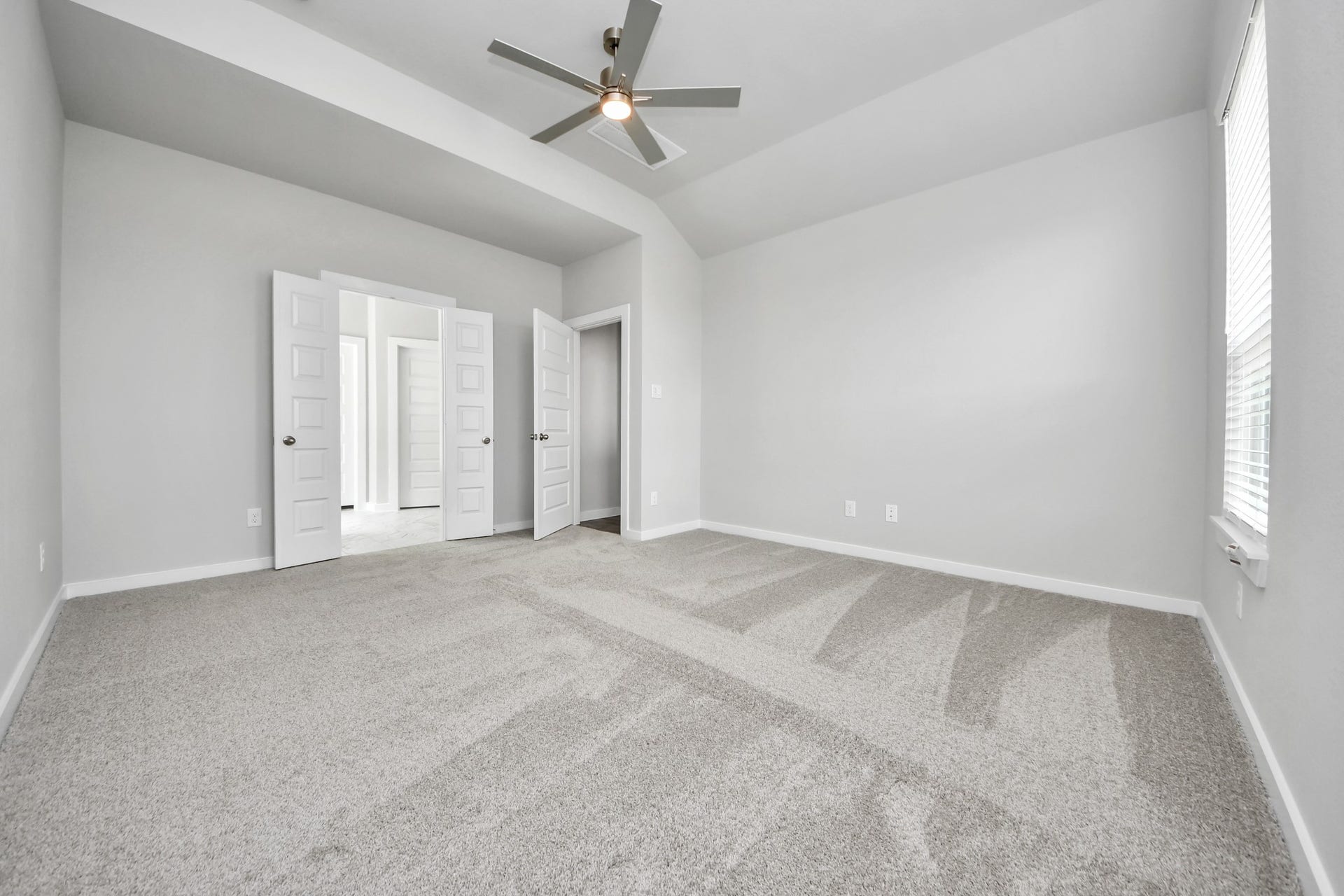 15315 Geranium Field Drive, Houston, TX 77044 Come and unwind after a long day in this magnificent primary suite! This spacious room features plush carpet, warm paint, high ceilings and large windows with privacy blinds. Sample photo of completed home with similar floor plan. Actual colors and selections may vary.