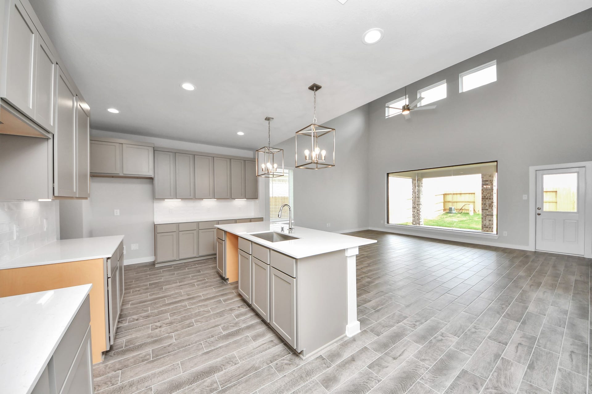 15315 Geranium Field Drive, Houston, TX 77044 The kitchen is a culinary haven, featuring granite countertops, a tile backsplash, stainless steel appliances, 42 upper cabinets, and undercabinet lighting. Sample photo of completed home with similar floor plan. Actual colors and selections may vary.