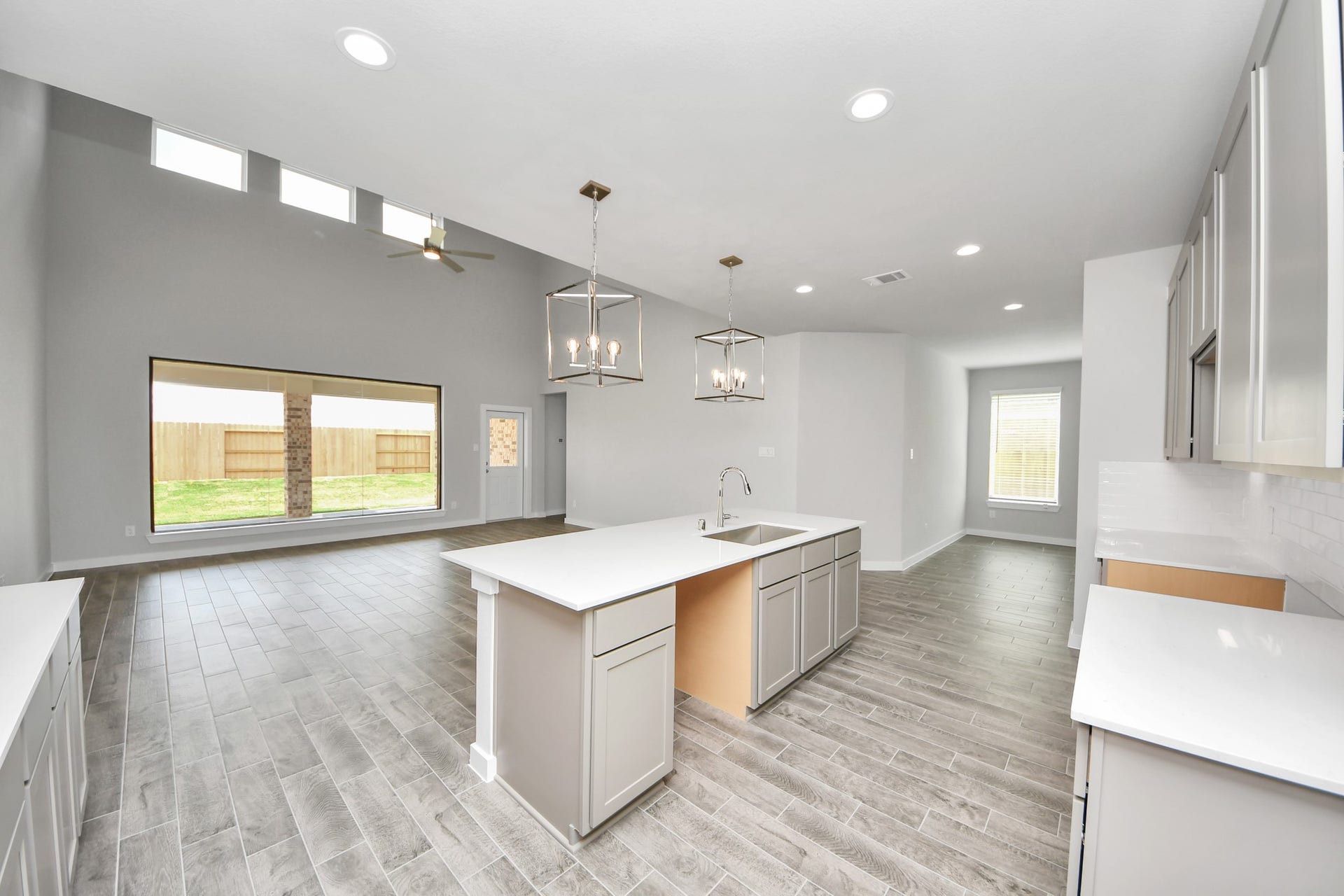 15315 Geranium Field Drive, Houston, TX 77044 All of this overlooks your expansive family room, creating a perfect space for culinary delights and family gatherings. Sample photo of completed home with similar floor plan. Actual colors and selections may vary.