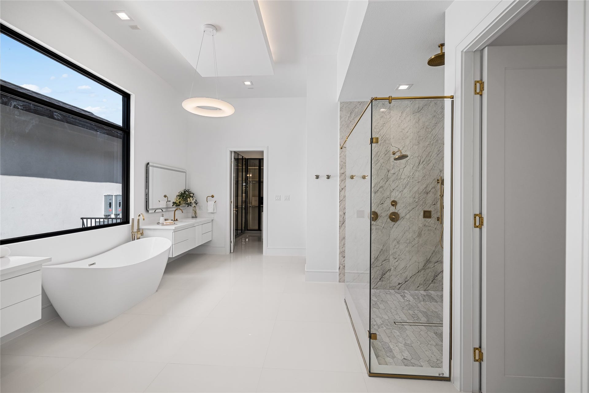Inside this incredible spa retreat, two private walk-in closets for effortless organization and abundant storage. A luxurious walk-in shower, a separate water-closet, and a dedicated beauty vanity space to prepare for the day.