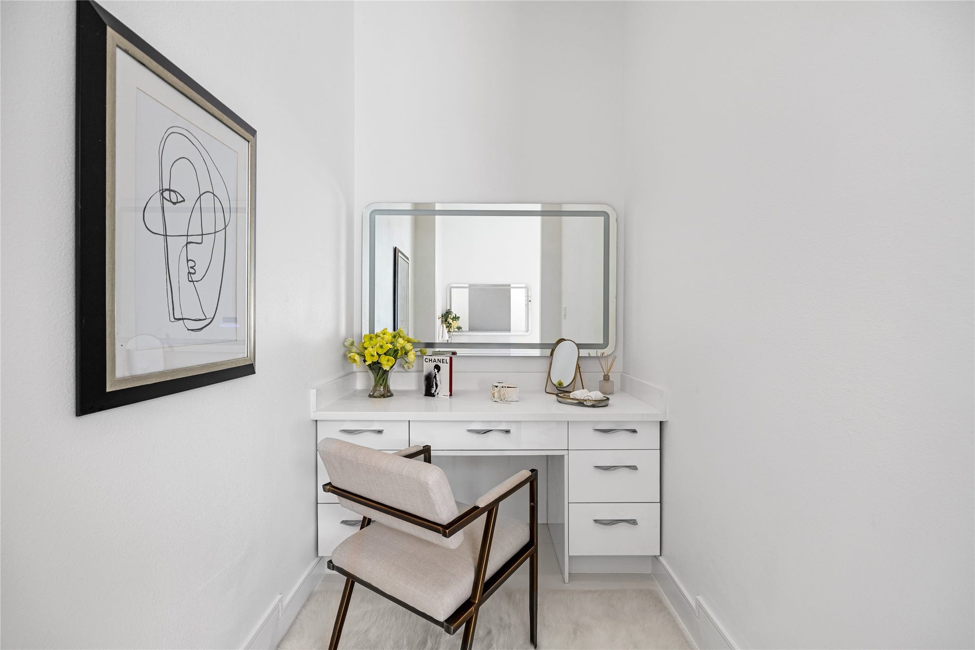 A closer look at this illuminated seated vanity with generous built-in drawers and dedicated lighting. This is the perfect personal retreat.