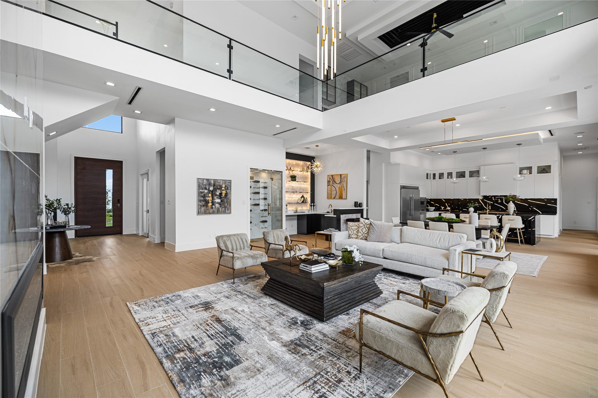 This vantage point captures it all: an effortless floor plan connecting the living, dining, kitchen, and entry beneath a dramatic two-story overlook. A floor plan built for both grand entertaining and everyday ease.