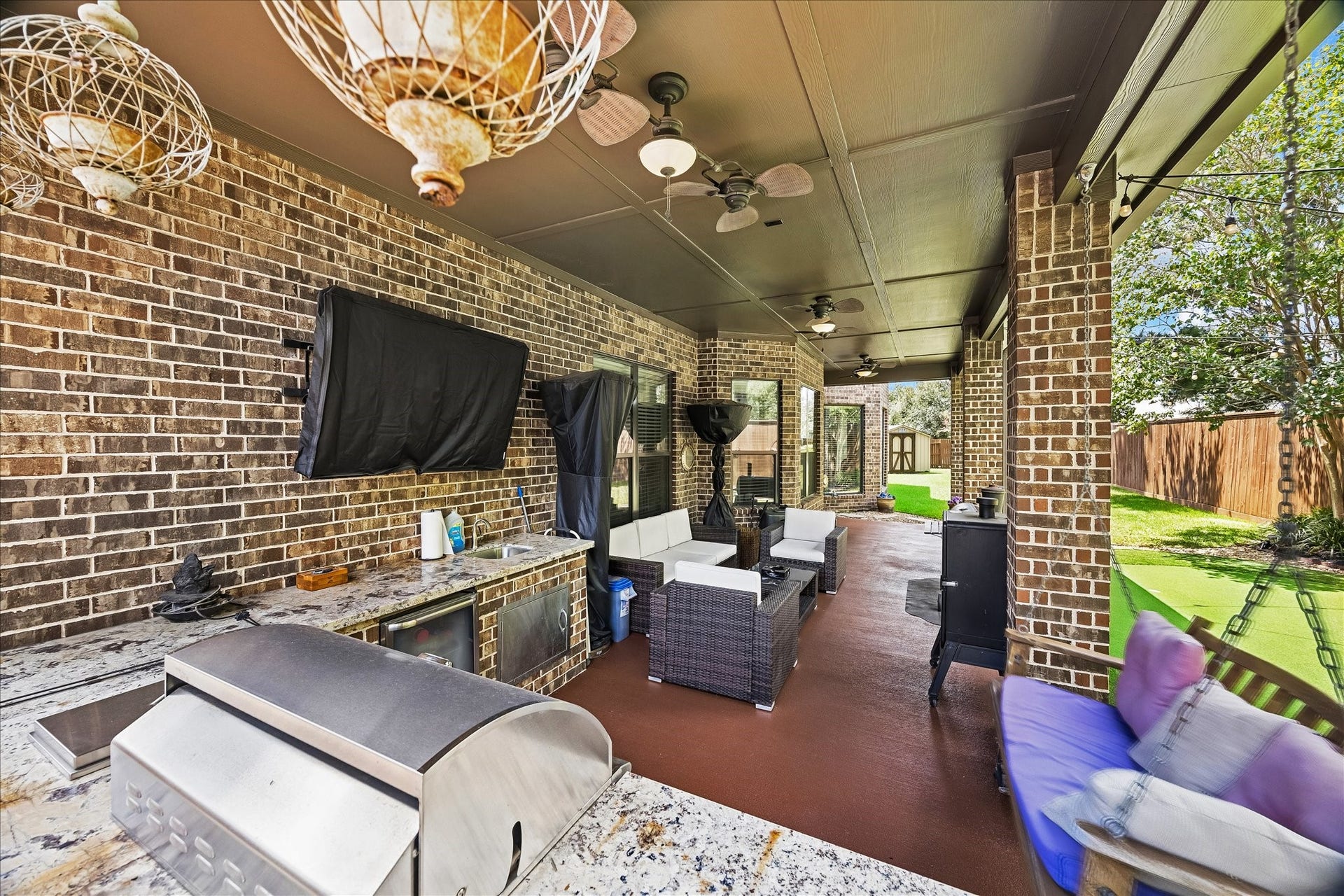 17427 Stonebrook Run Court, Tomball, TX 77375 The living space extends beyond the back door, complete with a full outdoor kitchen for easy entertaining.