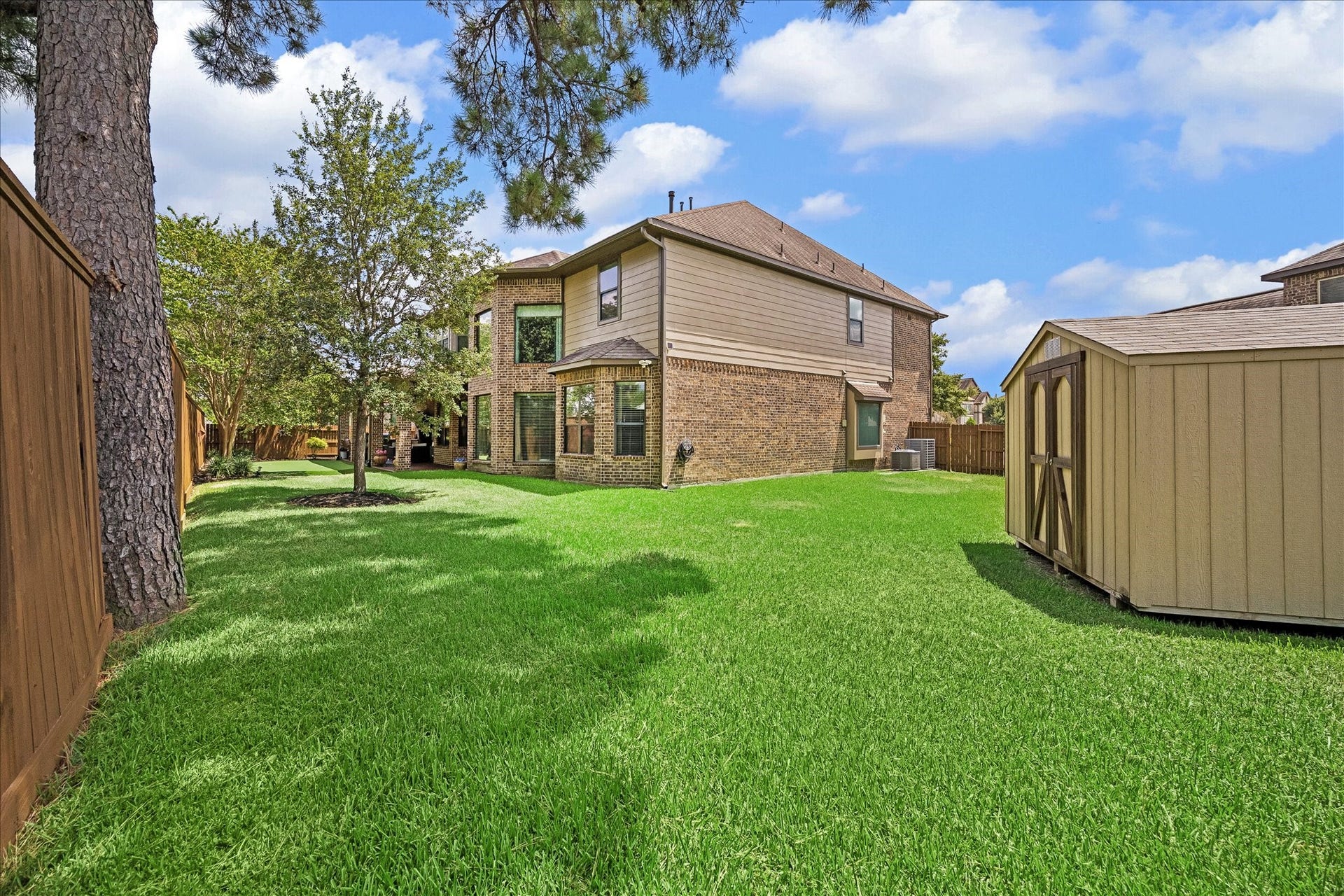 17427 Stonebrook Run Court, Tomball, TX 77375 And there's still lawn beyond the entertainment areas. Pets can run, kids can play and there's room for a pool.