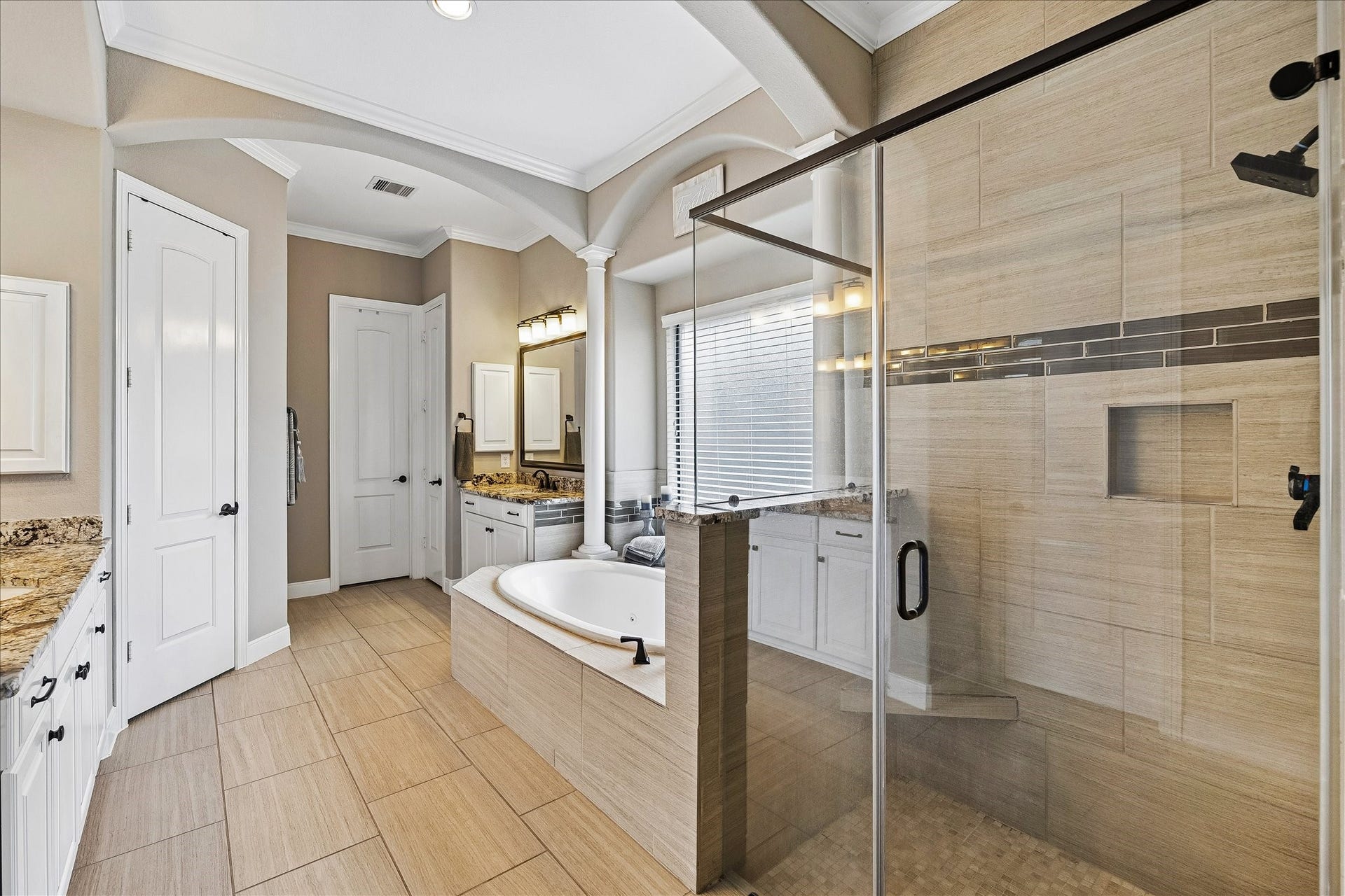 17427 Stonebrook Run Court, Tomball, TX 77375 Sharing the primary suite doesnt mean sharing everything. His-and-her closets provide separate storage for each person.