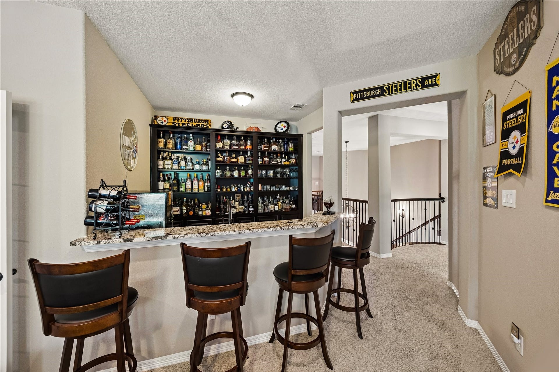 17427 Stonebrook Run Court, Tomball, TX 77375 The second floor was made for entertaining. The upstairs bar keeps refreshments close to the game room and theater.