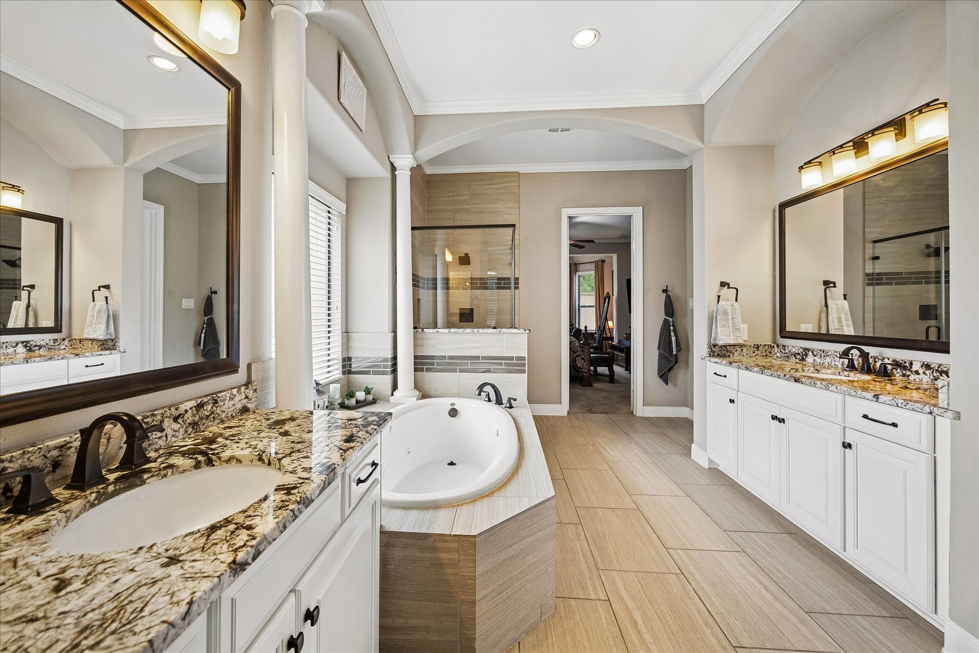 17427 Stonebrook Run Court, Tomball, TX 77375 Separate vanities make sharing the morning routine easier, while both a soaking tub and oversized shower let you choose between getting ready quickly and slowing things down.