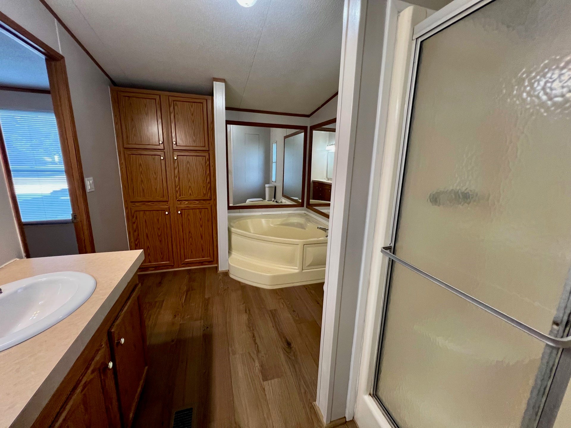16128 Lone Star Ranch Drive, Conroe, TX 77302 Primary bath with soaking tub and linen closet.