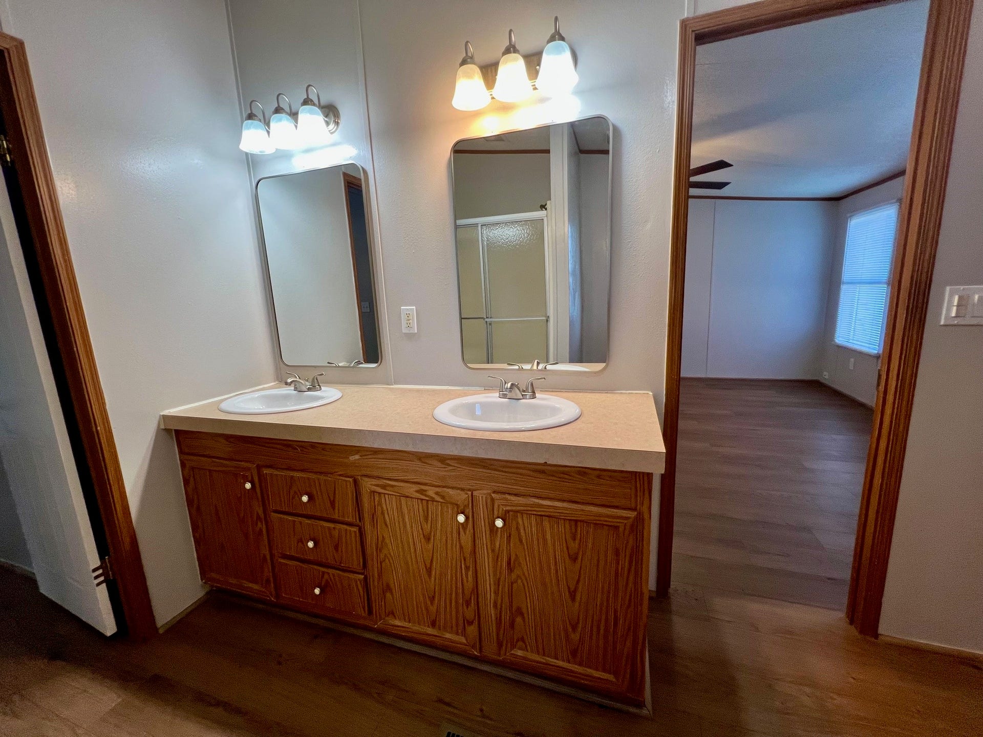 16128 Lone Star Ranch Drive, Conroe, TX 77302 Primary bath has new sinks, faucets, and mirrors.
