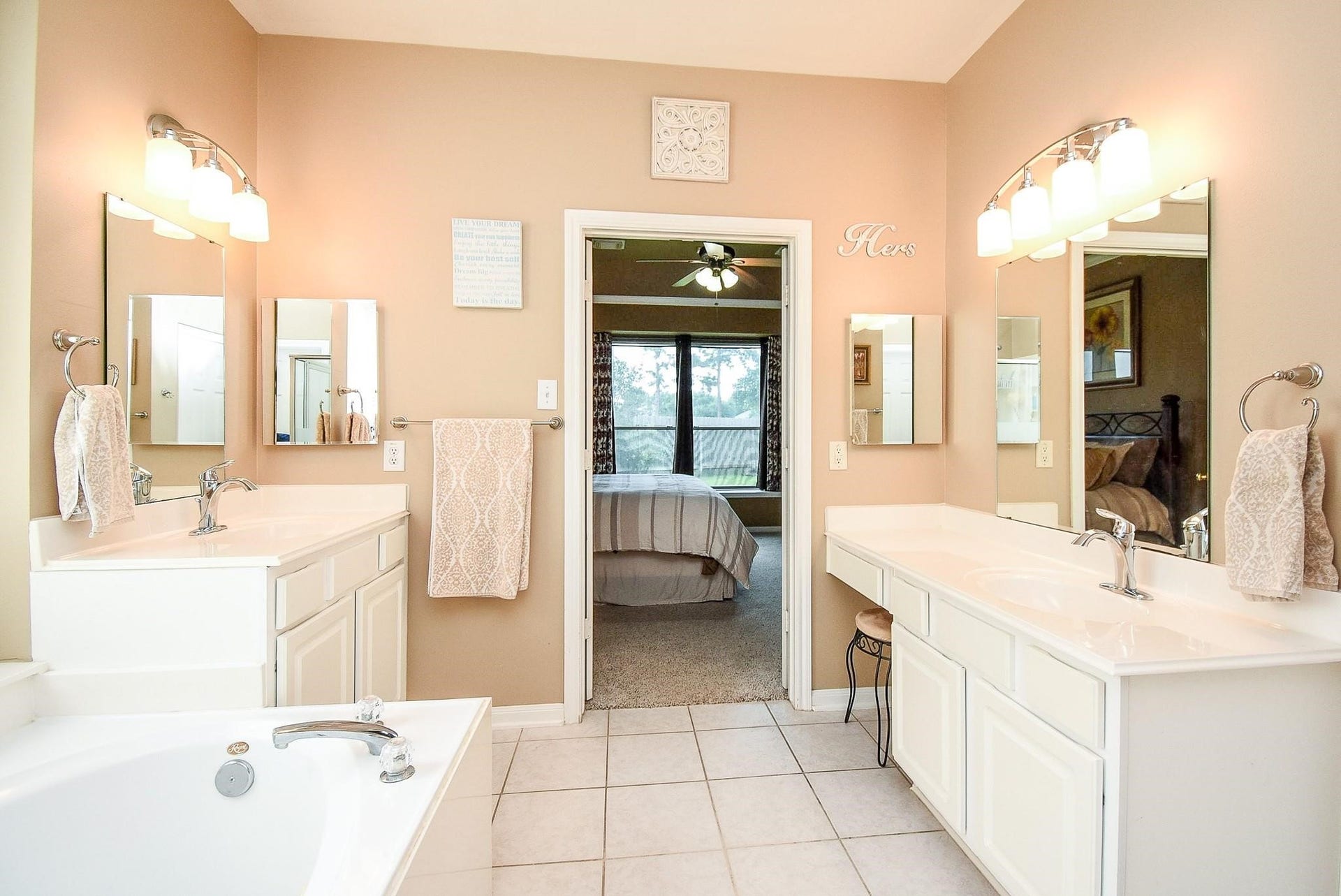 1727 Maryvale Drive, Katy, TX 77494 Luxurious primary bathroom with dual vanities and a spacious his-and-hers closets.