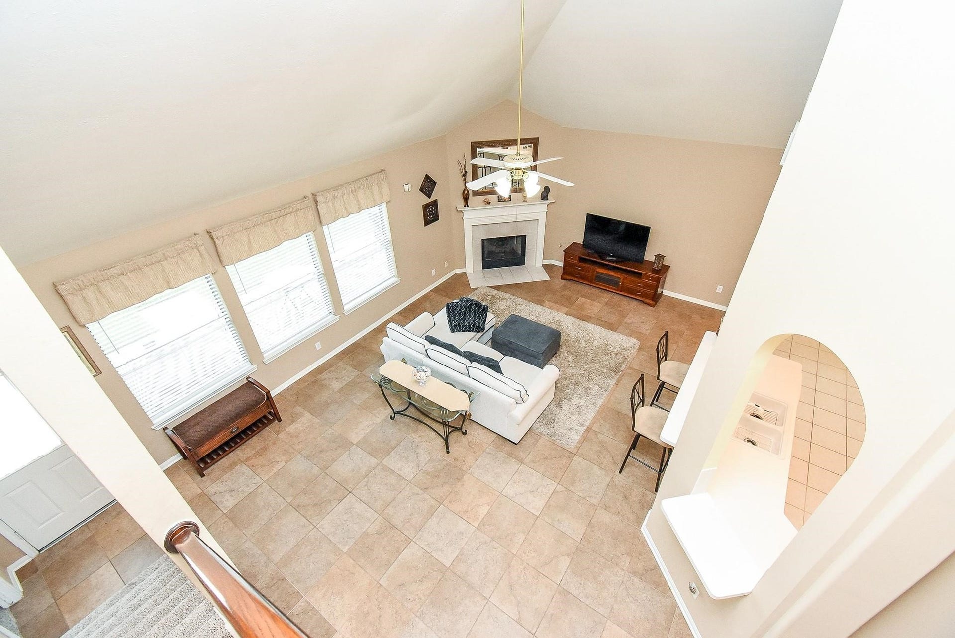 1727 Maryvale Drive, Katy, TX 77494 Enjoy a stunning overlook from the game room into the spacious, inviting family room below.