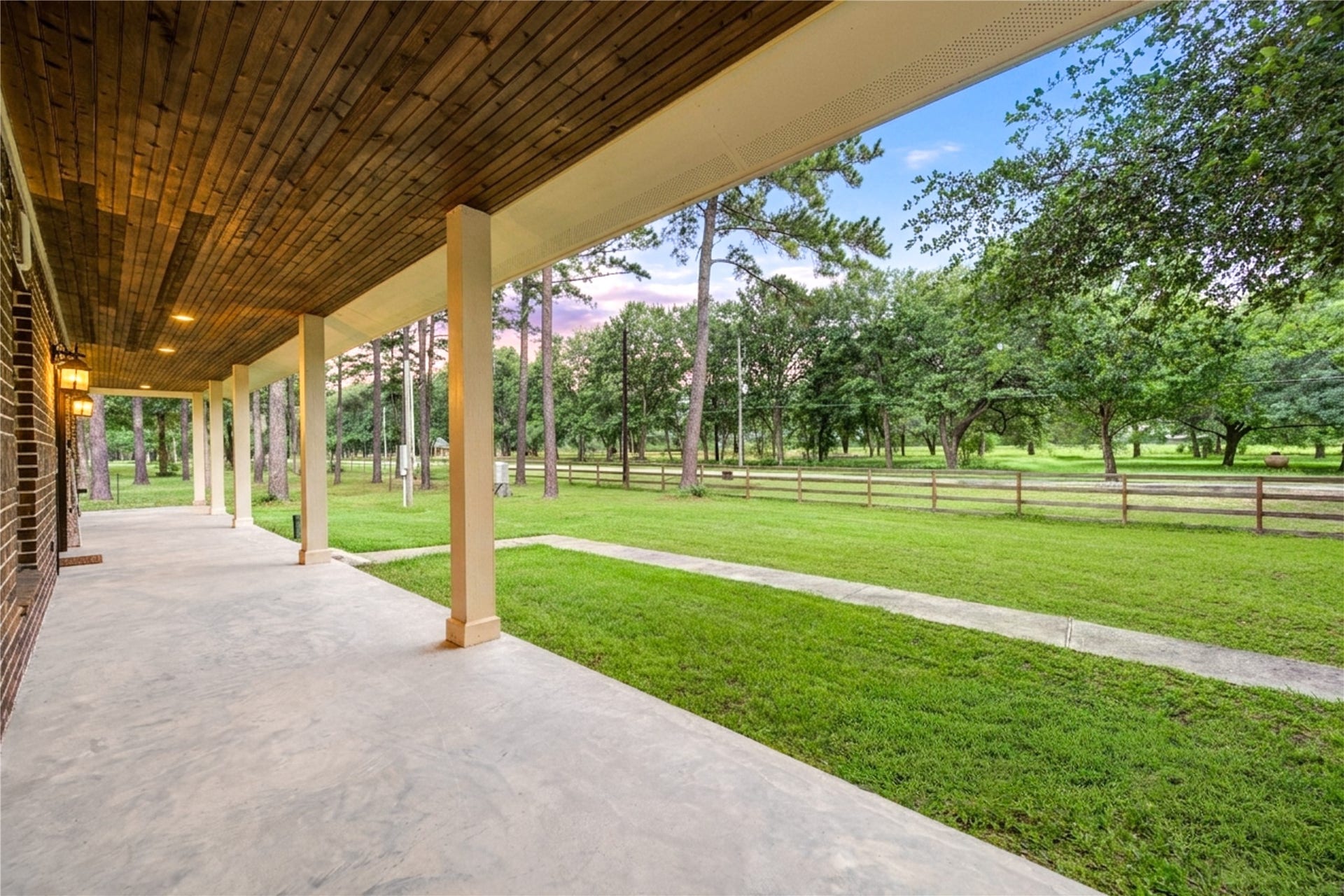 20531 Faye Street, Tomball, TX 77377 Expansive wraparound porch with wooded views.
