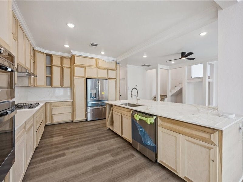 2123 Kingston Street, Houston, TX 77019 Kitchen Spacious kitchen taking shape with custom on-site-crafted cabinetry, generous counter space, stainless-steel appliances, gas cooking, and an oversized island. Cabinetry and finish work are still underway.
