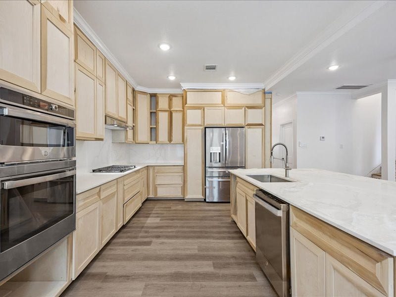 2123 Kingston Street, Houston, TX 77019 Kitchen & Appliances Renovated kitchen features custom cabinetry, stainless-steel appliances, gas cooking, expansive countertops, and abundant storage. Final cabinetry and finishing work are still underway.
