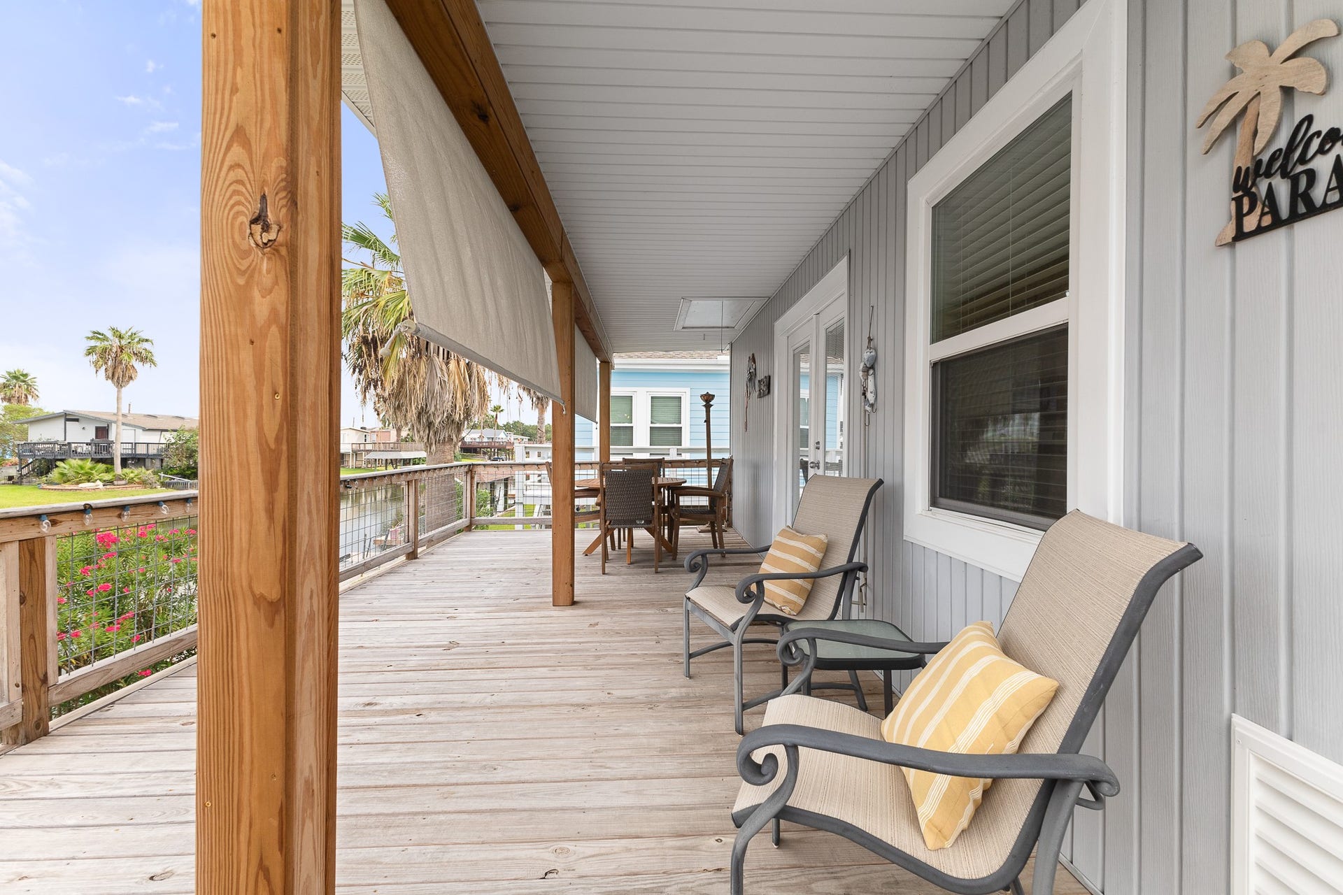 66 Tarpon Street, Bayou Vista, TX 77563 Spacious covered waterfront deck with plenty of room to relax and enjoy canal views.