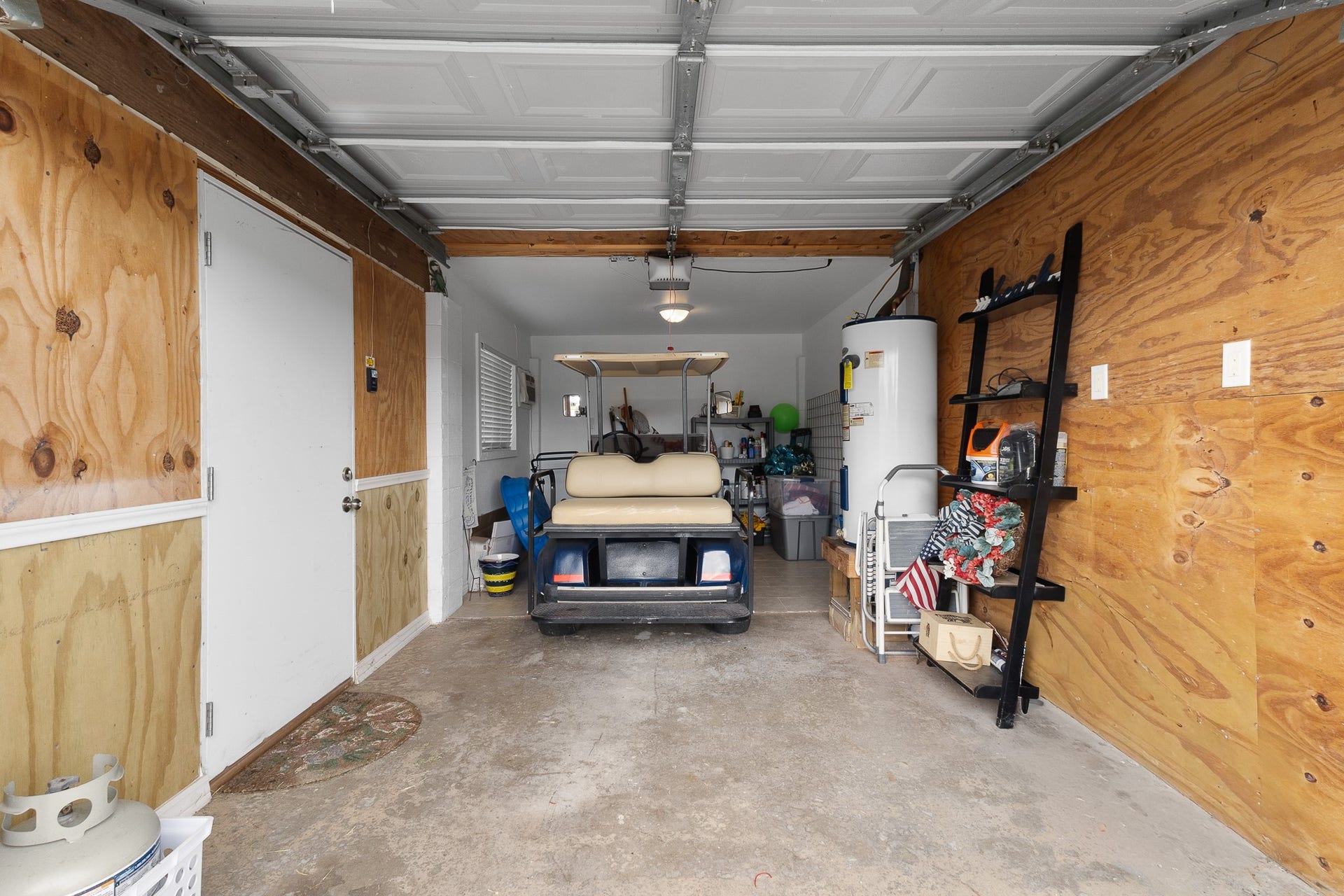 66 Tarpon Street, Bayou Vista, TX 77563 Garage provides convenient storage for the golf cart and all the extras that come with coastal living.