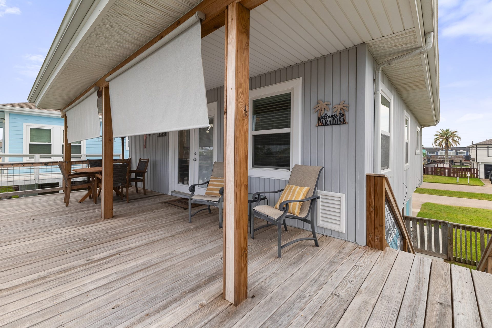 66 Tarpon Street, Bayou Vista, TX 77563 Covered deck with roll-down shades for added comfort and shade.