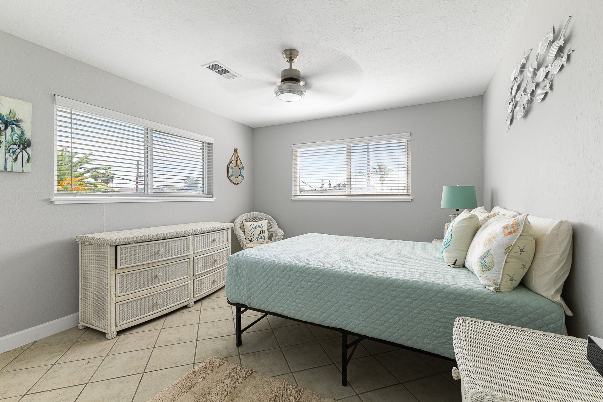 66 Tarpon Street, Bayou Vista, TX 77563 Second bedroom with coastal touches, tile flooring and great natural light.