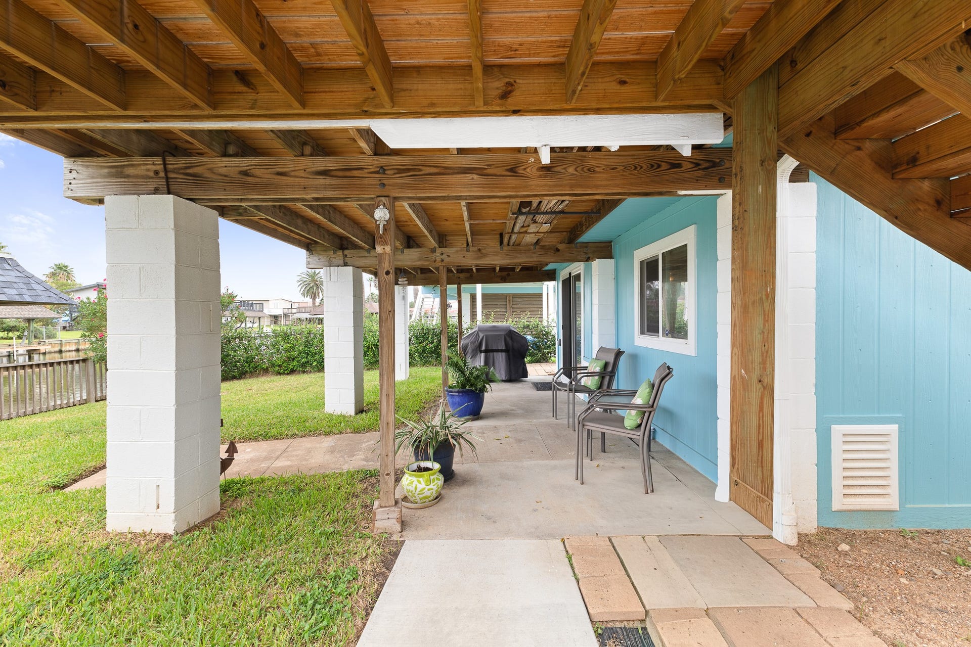 66 Tarpon Street, Bayou Vista, TX 77563 Covered ground-level patio offers additional outdoor living and entertaining space.