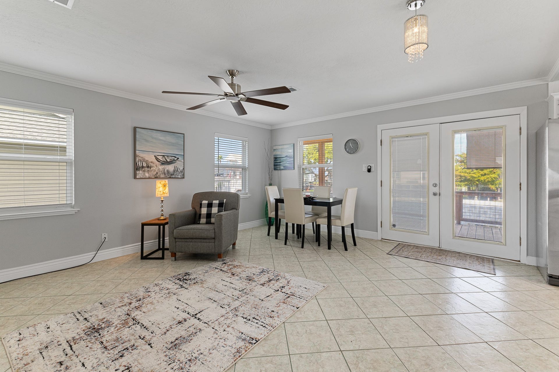 66 Tarpon Street, Bayou Vista, TX 77563 Open living and dining space with French doors leading to the waterfront deck.