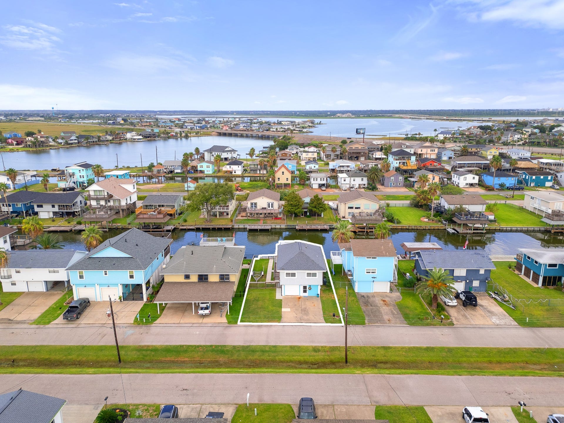 66 Tarpon Street, Bayou Vista, TX 77563 Aerial view highlighting the propertys location along the canal.