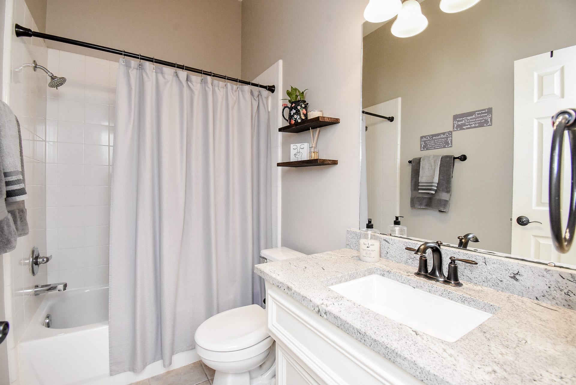 7218 Fall Creek Bend, Humble, TX 77396 Secondary bathroom offers neutral tile floors and under sink cabinet storage.