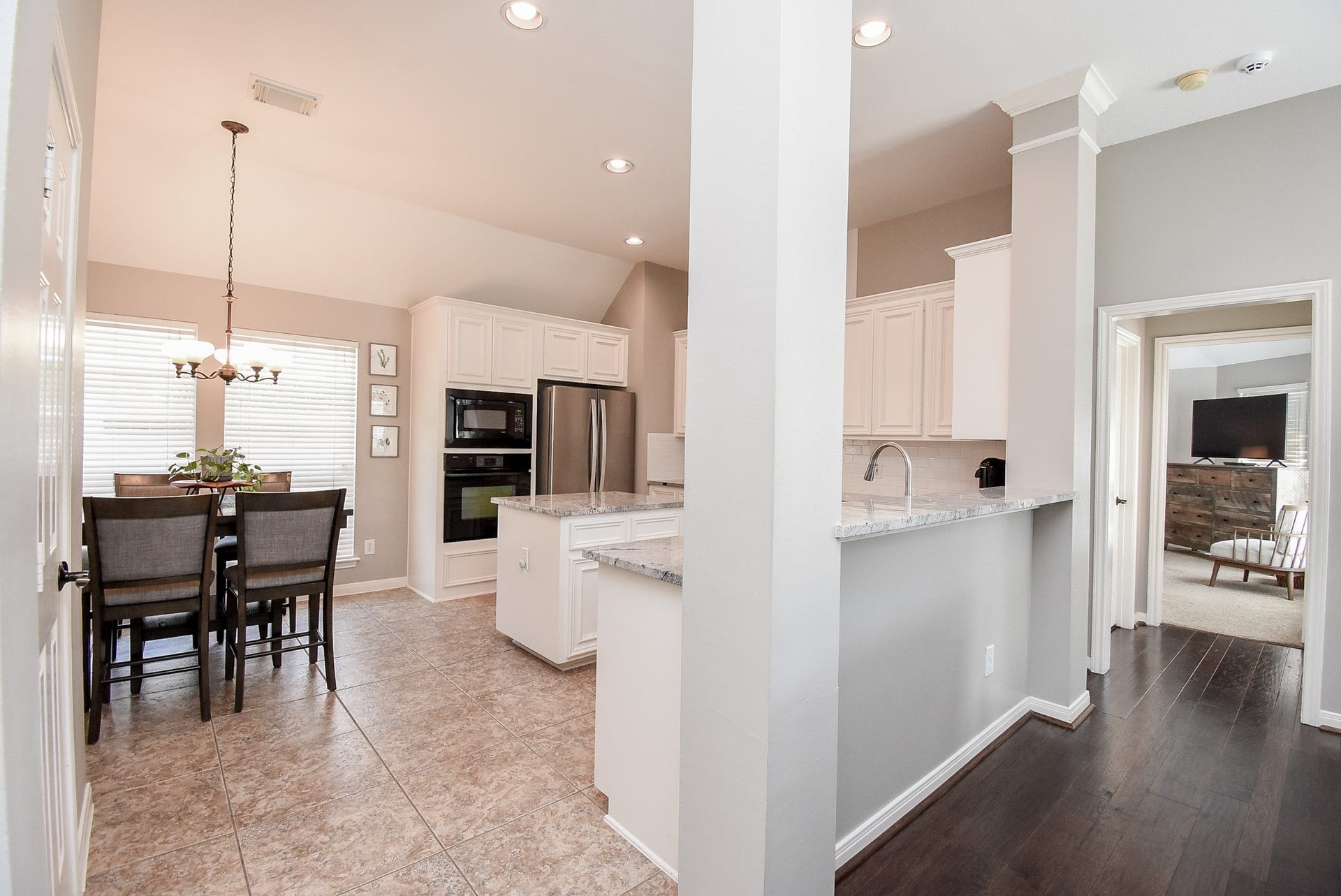7218 Fall Creek Bend, Humble, TX 77396 Island kitchen with breakfast area and pantry.