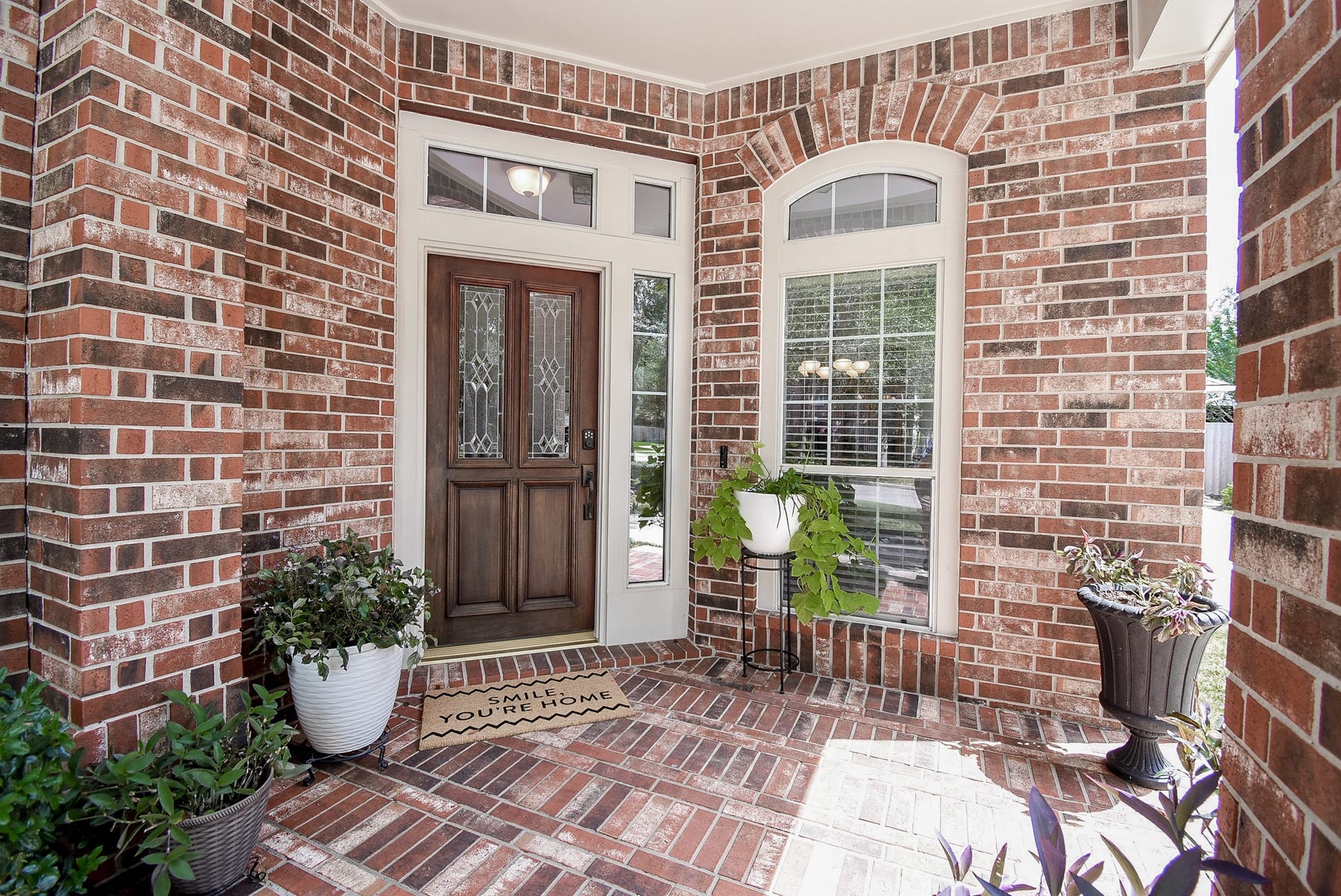 7218 Fall Creek Bend, Humble, TX 77396 Welcoming front porch with brick front porch and solid wood stain entry door!