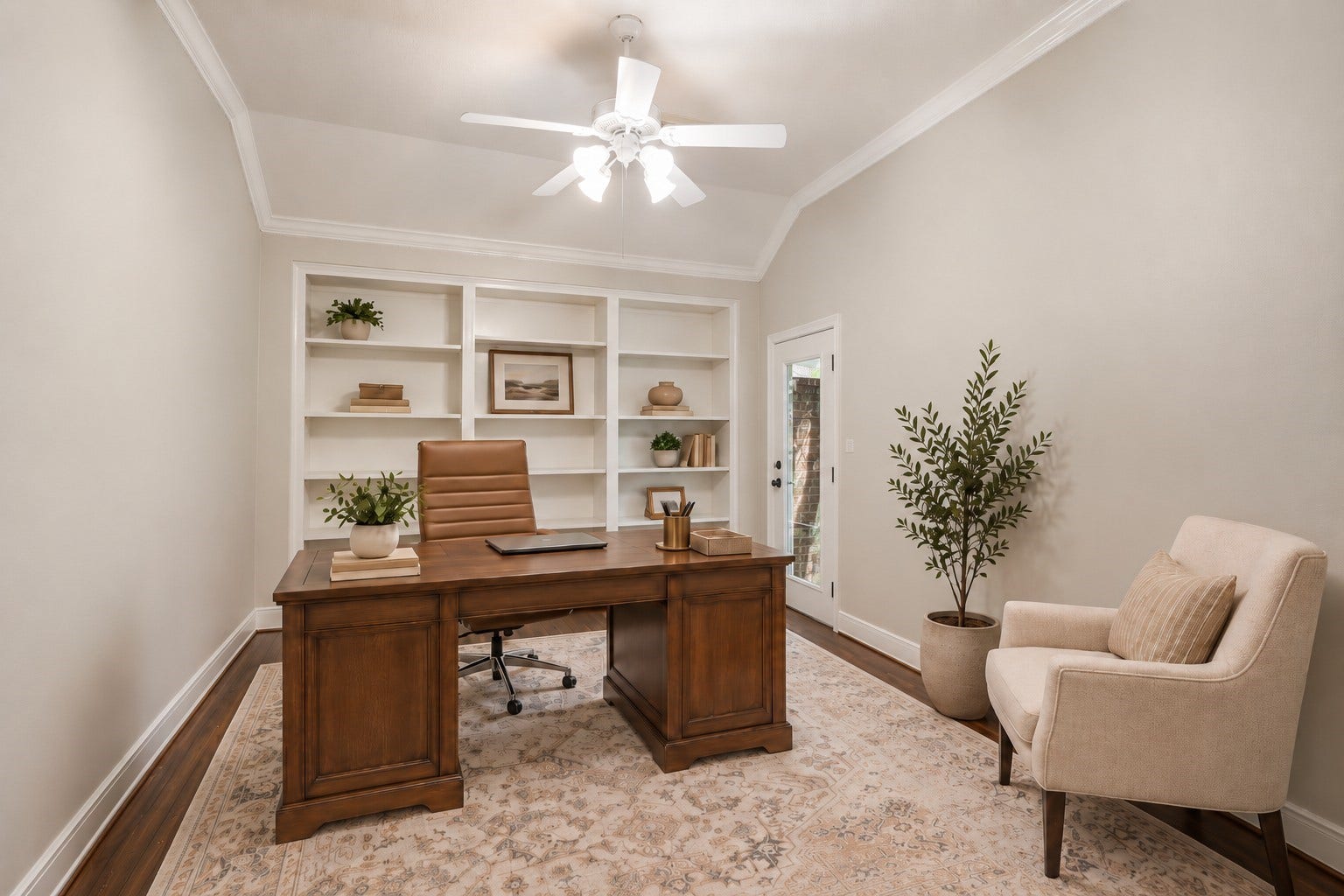 A versatile room near the front entry offers built-in shelving, a tray ceiling, and natural light, making it well suited for a home office or additional bedroom.**Virtually staged