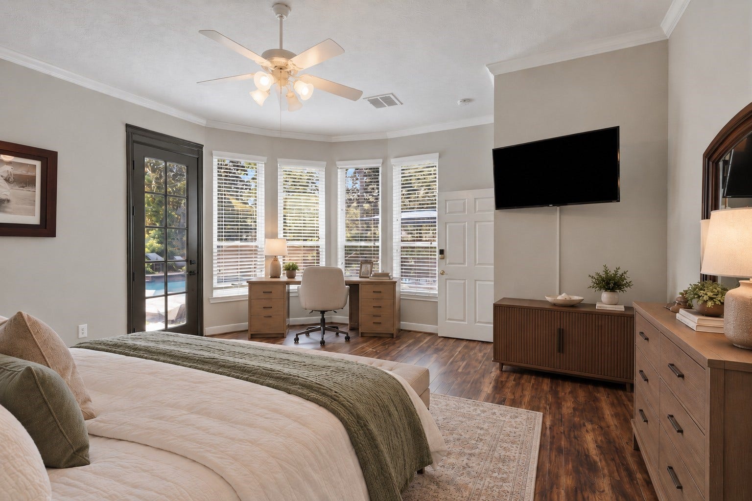 A wall of windows brings natural light into the primary suite, while the rooms size allows space for a separate work or sitting area.**Virtually staged