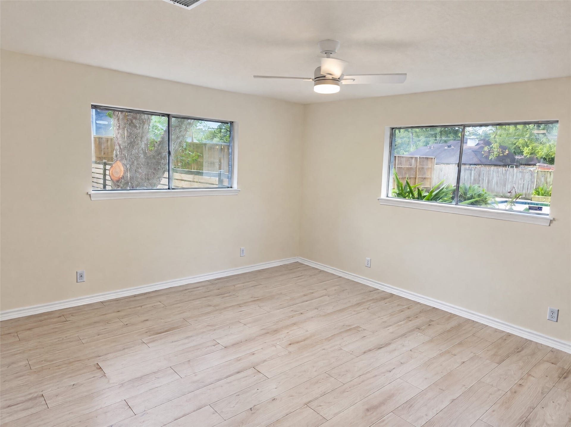 16411 Amcreek Road, Houston, TX 77068 Tucked away for peace and quiet, the primary bedroom boasts ample proportions, clean lines, and an overhead ceiling fan.