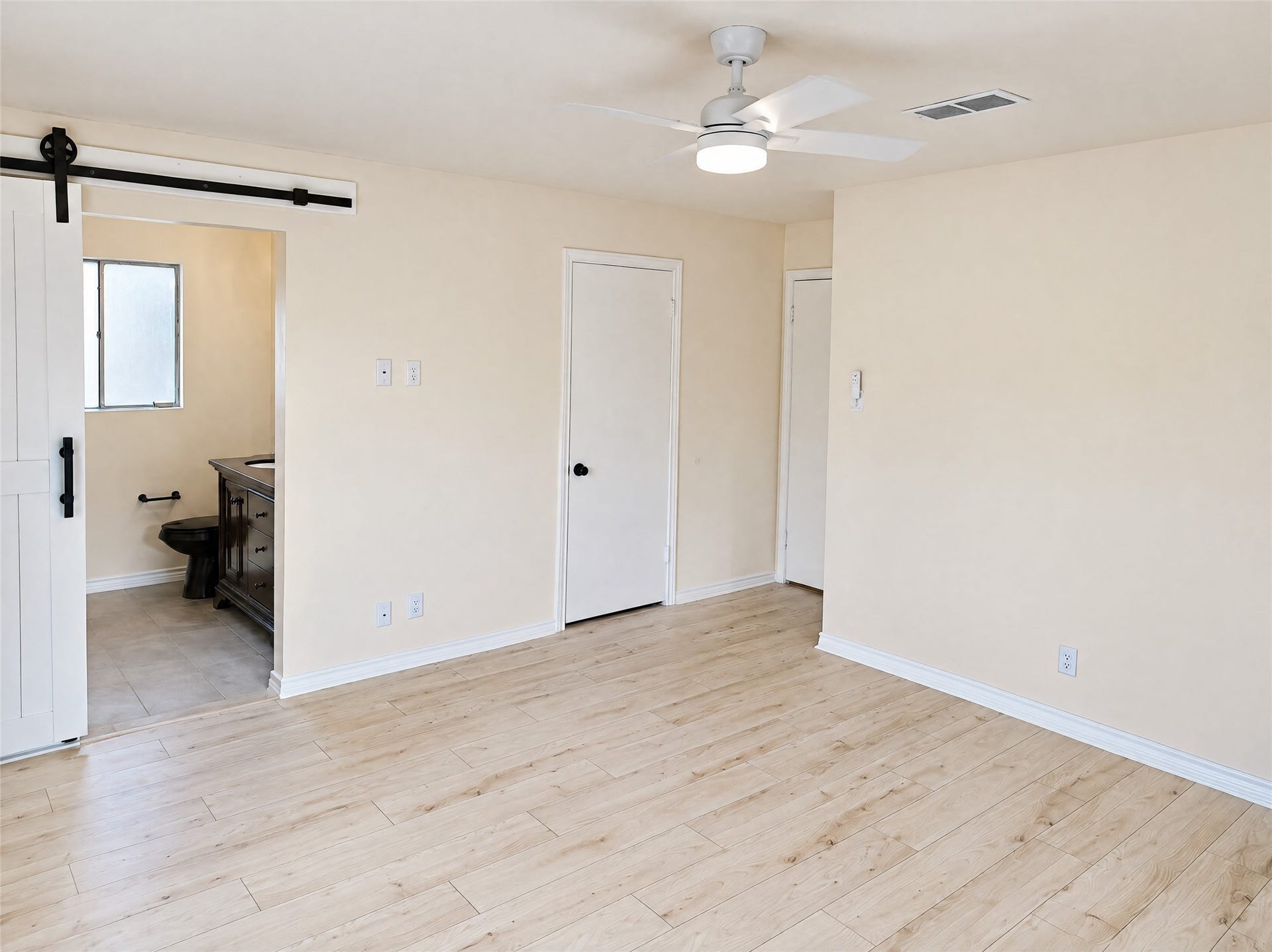 16411 Amcreek Road, Houston, TX 77068 A custom sliding barn door opens directly into the en-suite bathroom for added privacy and charm.