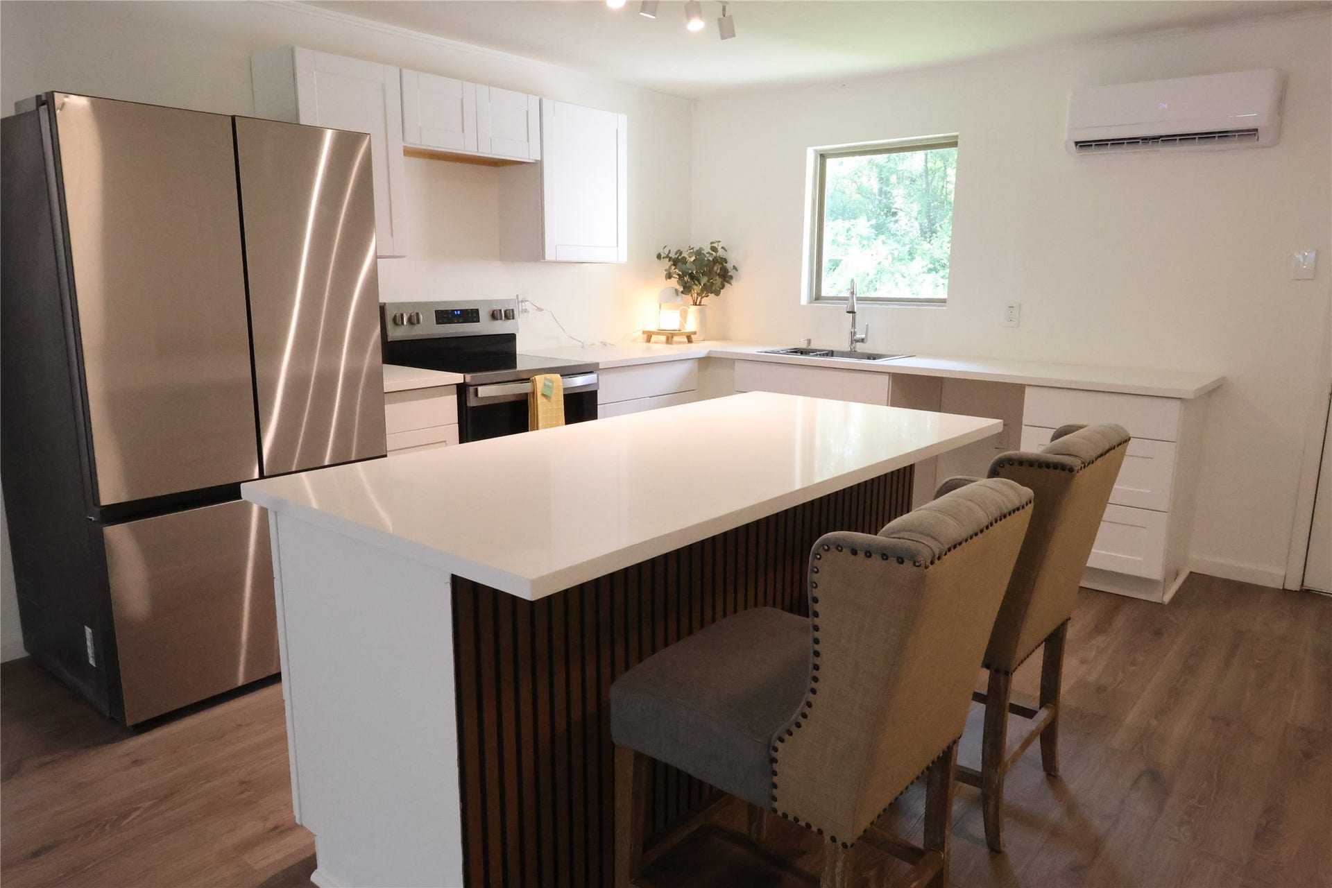 Welcome to 21805 Baptist Encampment! Kitchen includes new cabinets, quartz countertops and stainless steel appliances.