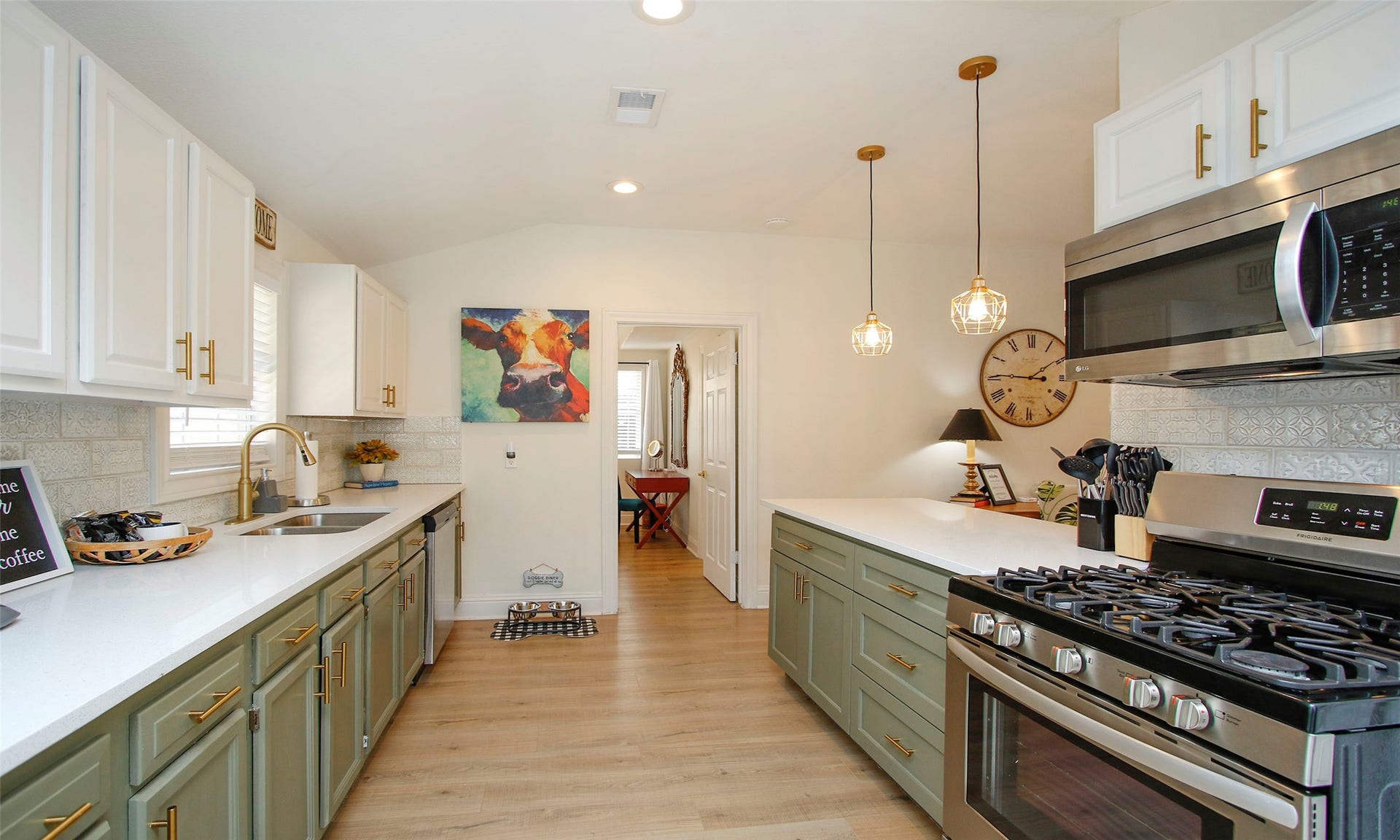 1518 Sabine Street, Houston, TX 77007 Another view of kitchen with quartz countertops, designer backsplash, pendant lighting, and plenty of storage.