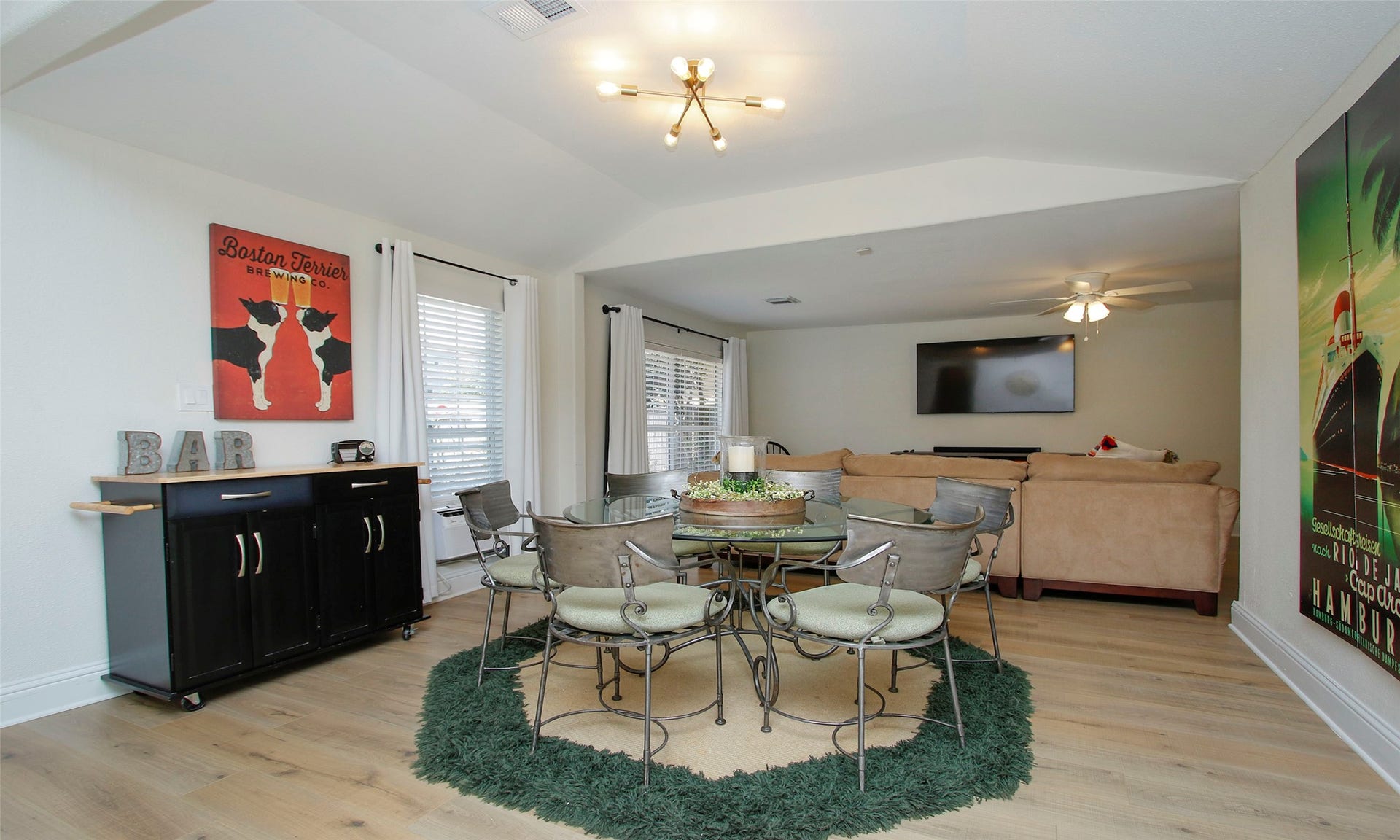 1518 Sabine Street, Houston, TX 77007 The spacious dining area is ideal for everyday meals or entertaining guests, featuring luxury vinyl plank flooring, abundant natural light, and an open-concept design that flows seamlessly into the living room and kitchen. (furnished/unfurnished)