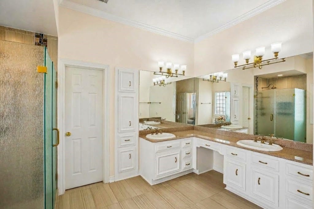 Frameless shower door for an oversized shower space. Walk-in closet with ample room for two.