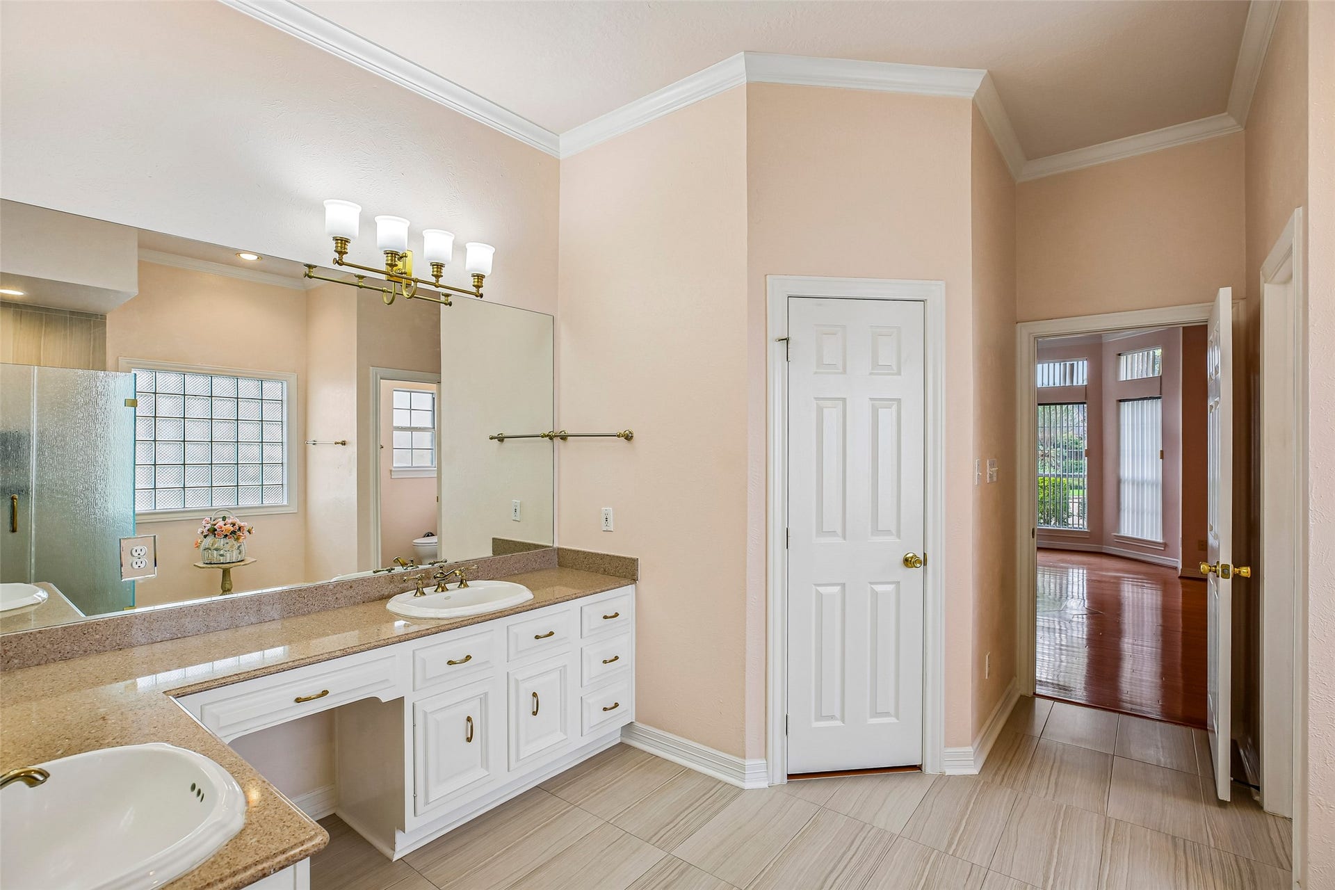 Granite countertops and double sinks in primary bath.